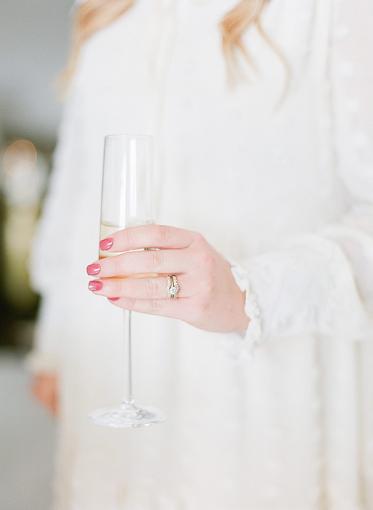 Detail of Bride To Be's Ring Hand Holding Champagne Glass Photo