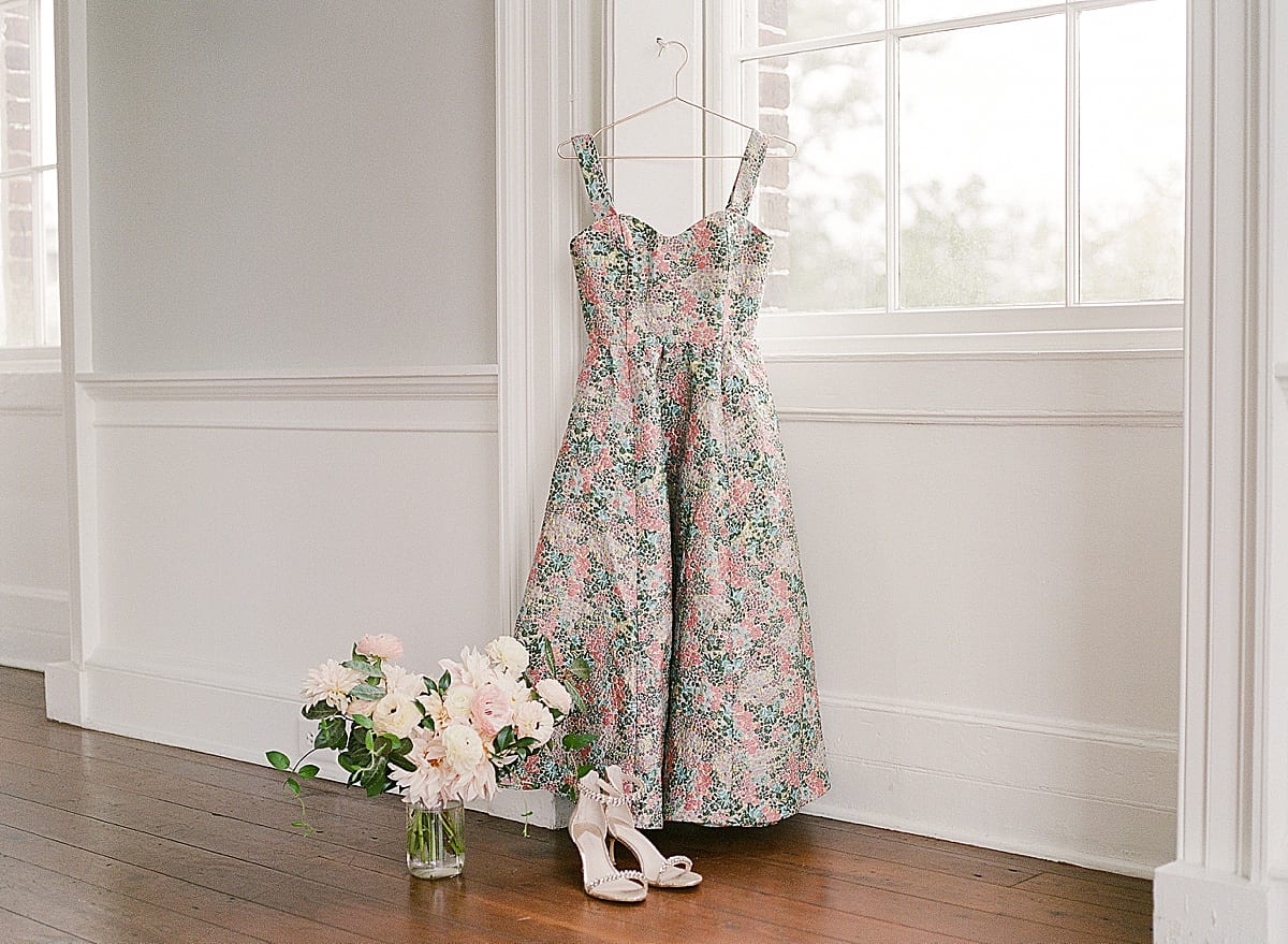 Detail of Dress Hanging with Bouquet and Shoes Photo