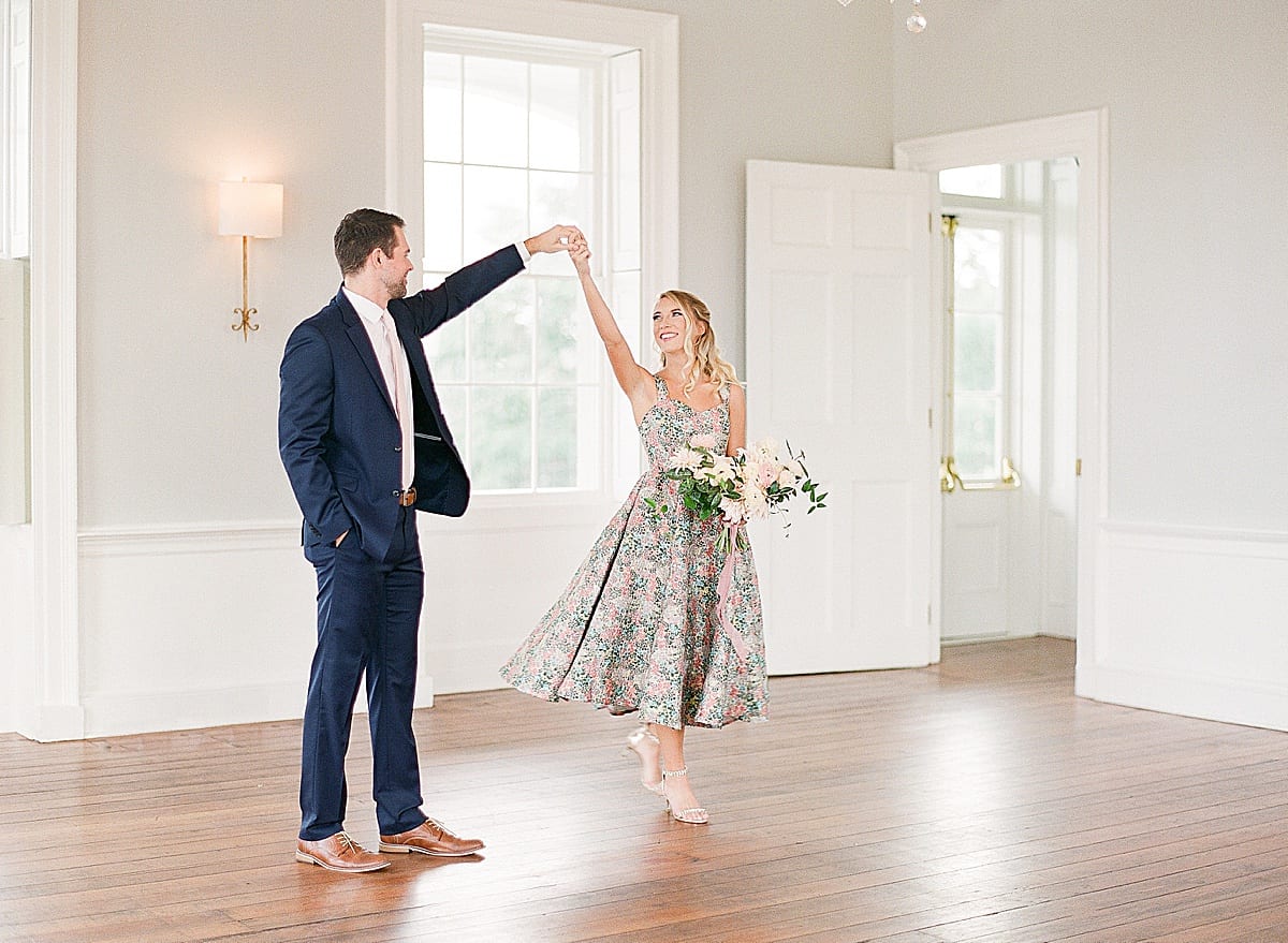 Charleston SC Wedding Venue Engagement Session Couple Spinning in Room Photo