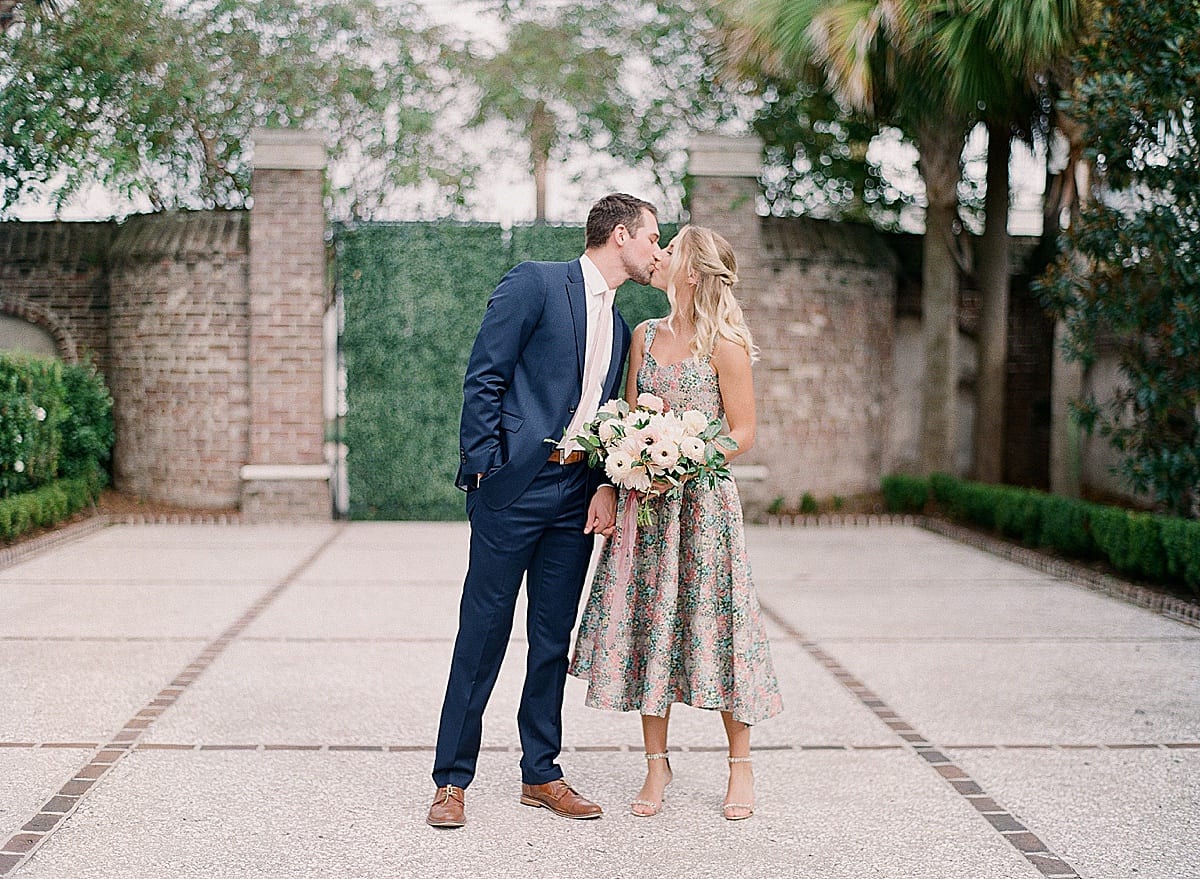 Charleston SC Wedding Venue Gadsden house Couple Kissing in Courtyard Photo