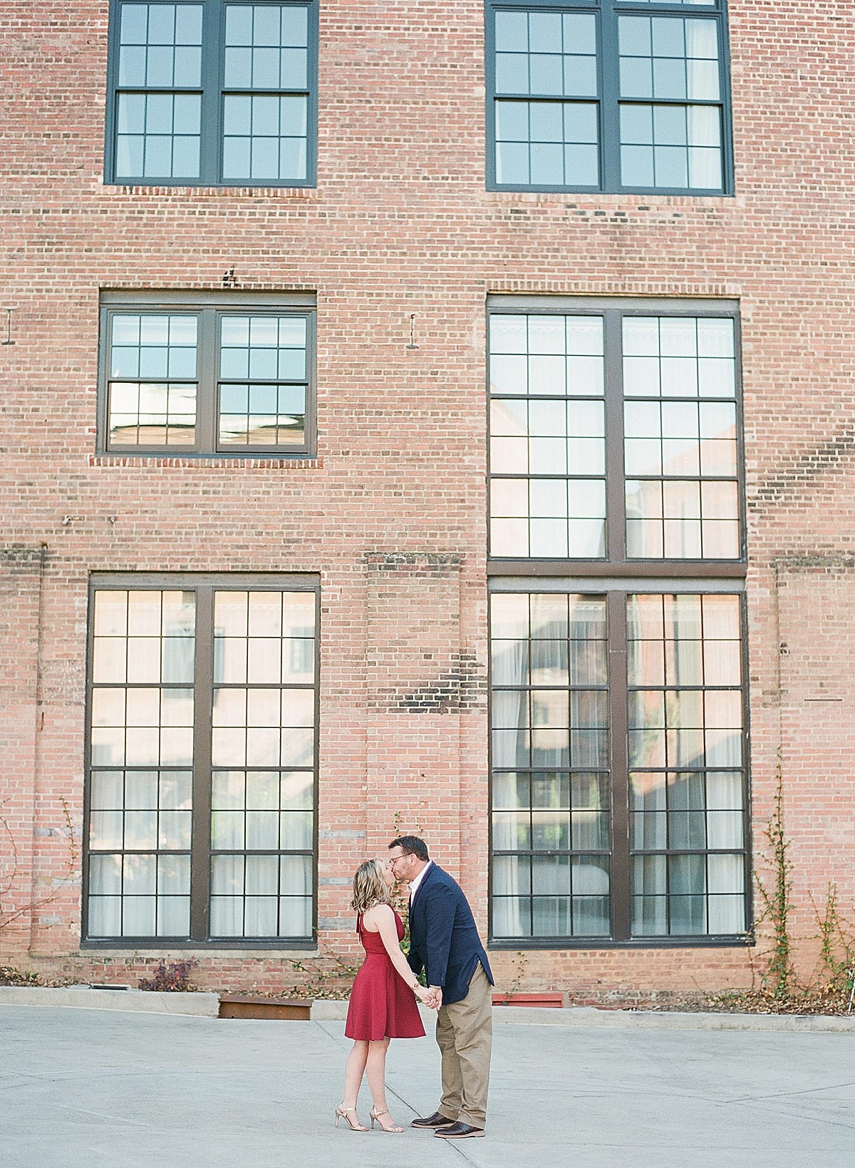 Engagement Session Couple Kissing at Downtown Asheville Hotel Photo