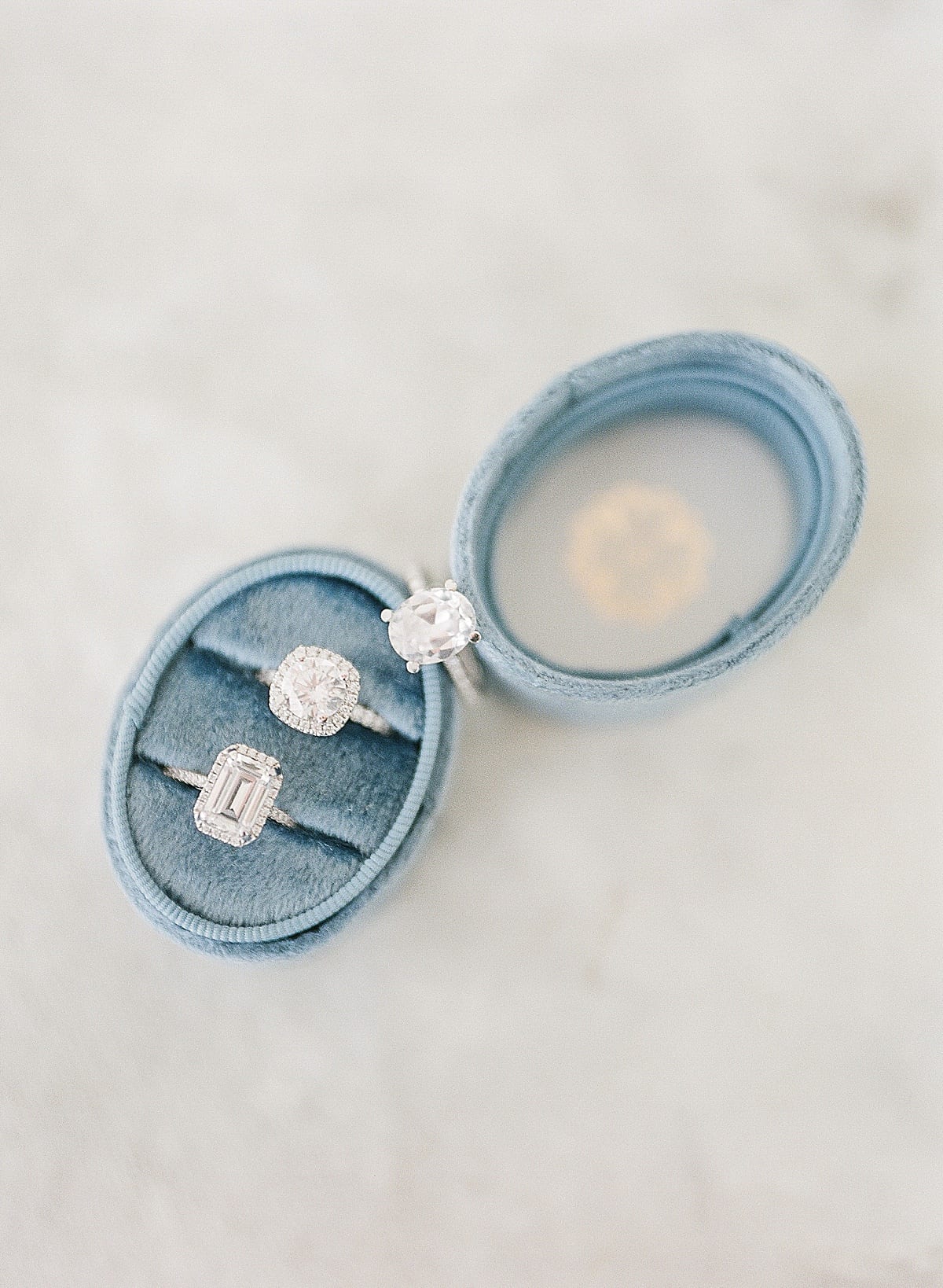 Set of Three Engagement Rings In Blue Ring Box Photo
