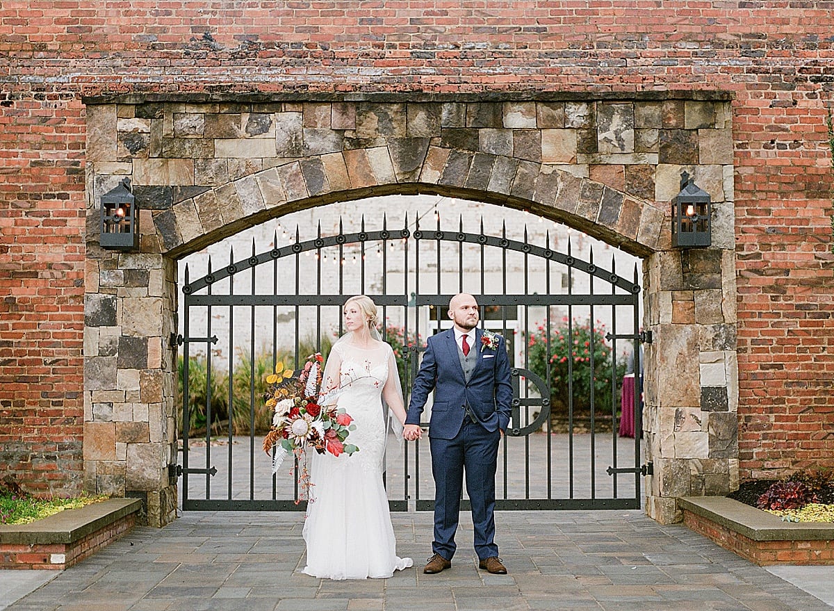 Bride and Groom looking off in front of Iron Gate Fall North Carolina Wedding Photo