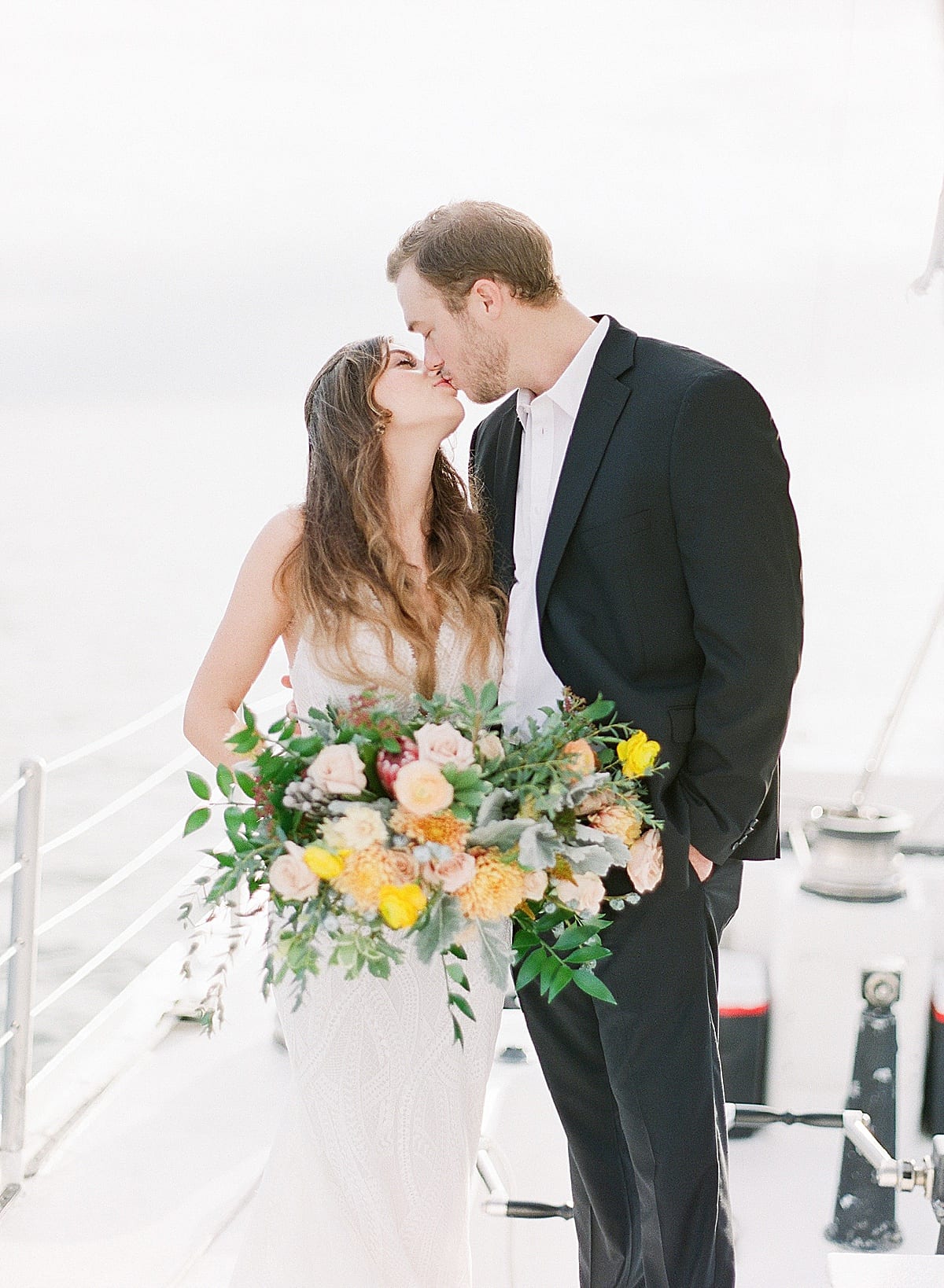 Hilton Head South Carolina Wedding Couple Kissing on Sailboat Photo