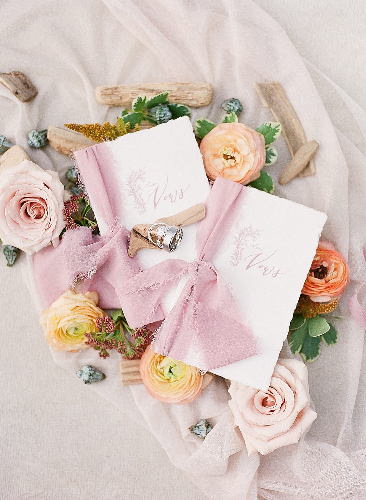 Wedding Vow Books with Flowers and Driftwood Photo