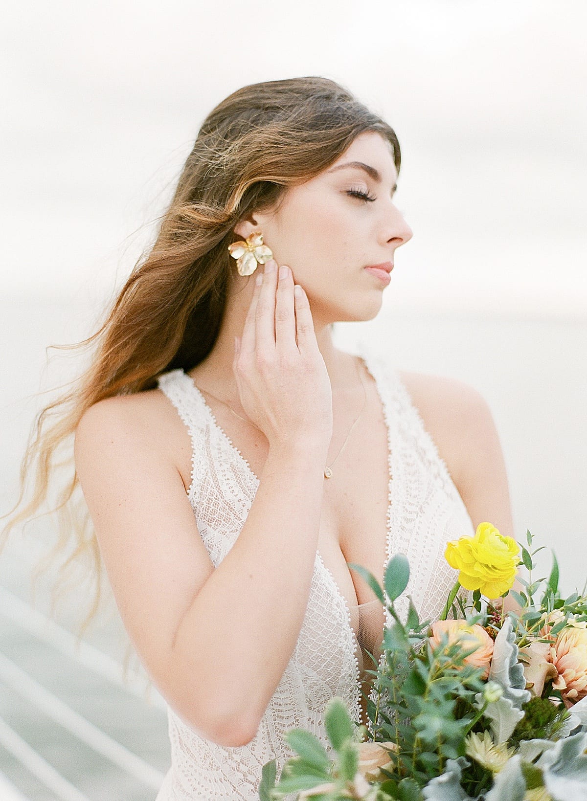 Profile of Bride Holding Bouquet with Eyes Closed Photo