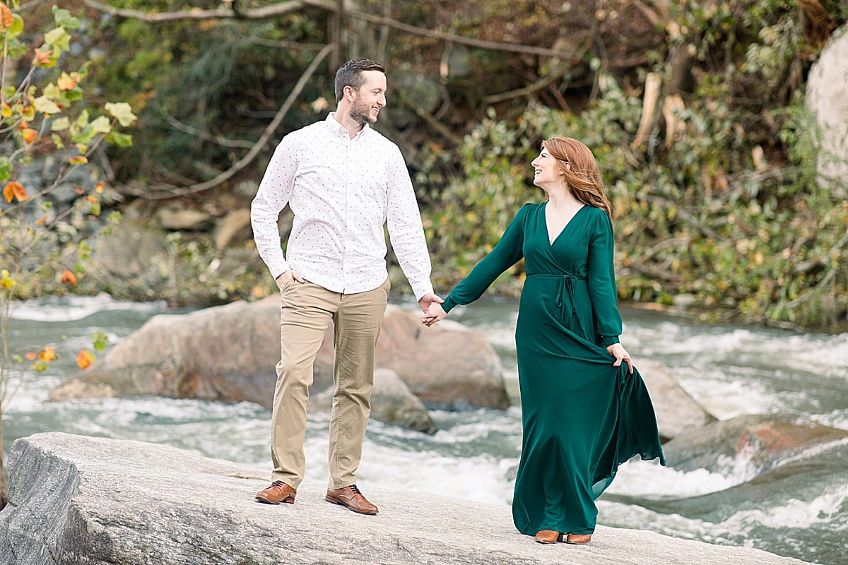 Couple Smiling at Each Other Holding Hands In the Broad River Photo