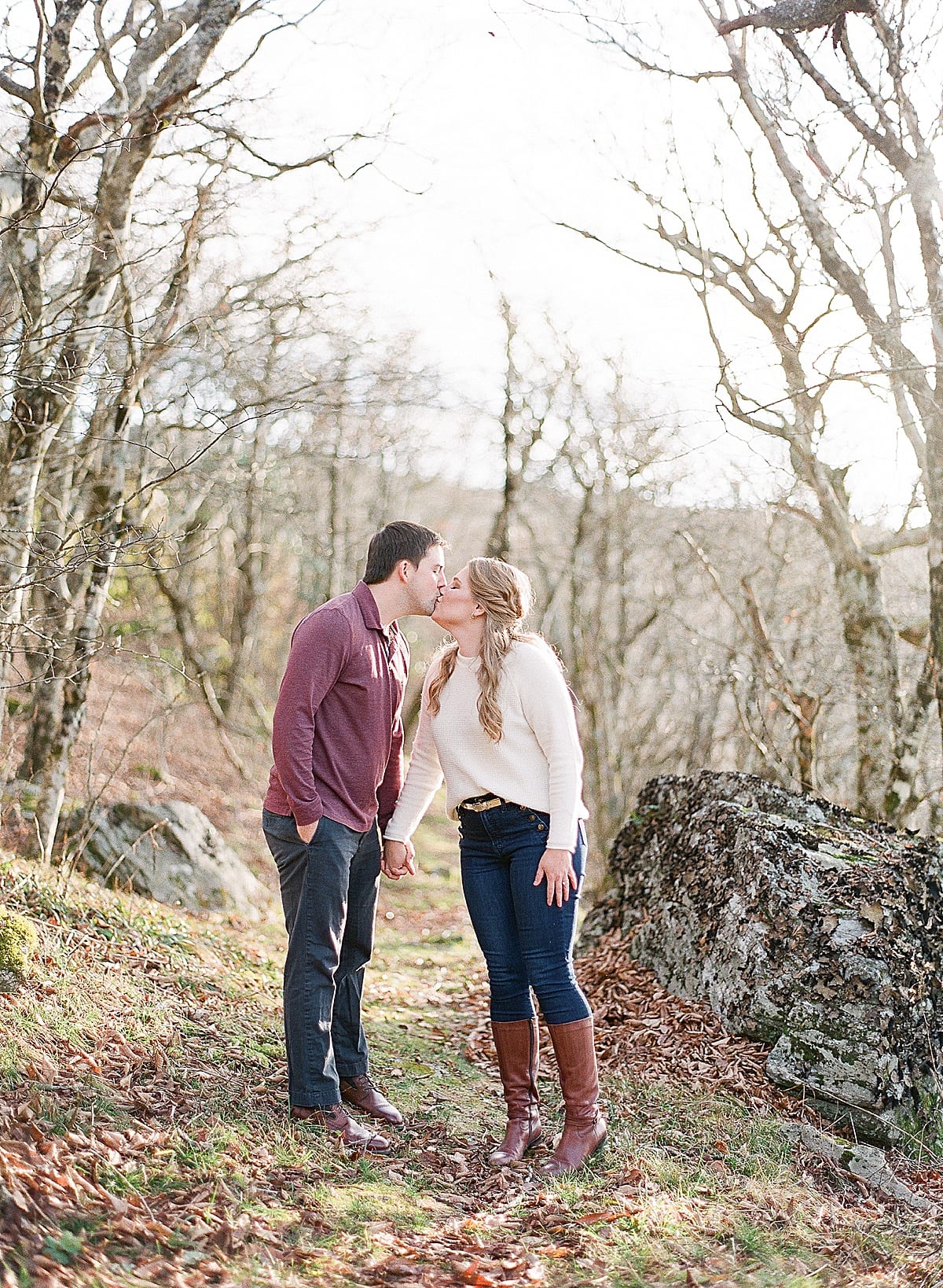 Couple Holding Hands and Kissing on Trail Photo