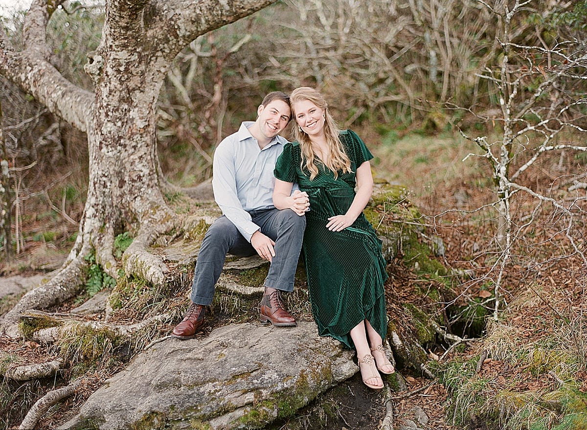 Couple Sitting Under Tree at Mountaintop Engagement Session Photo