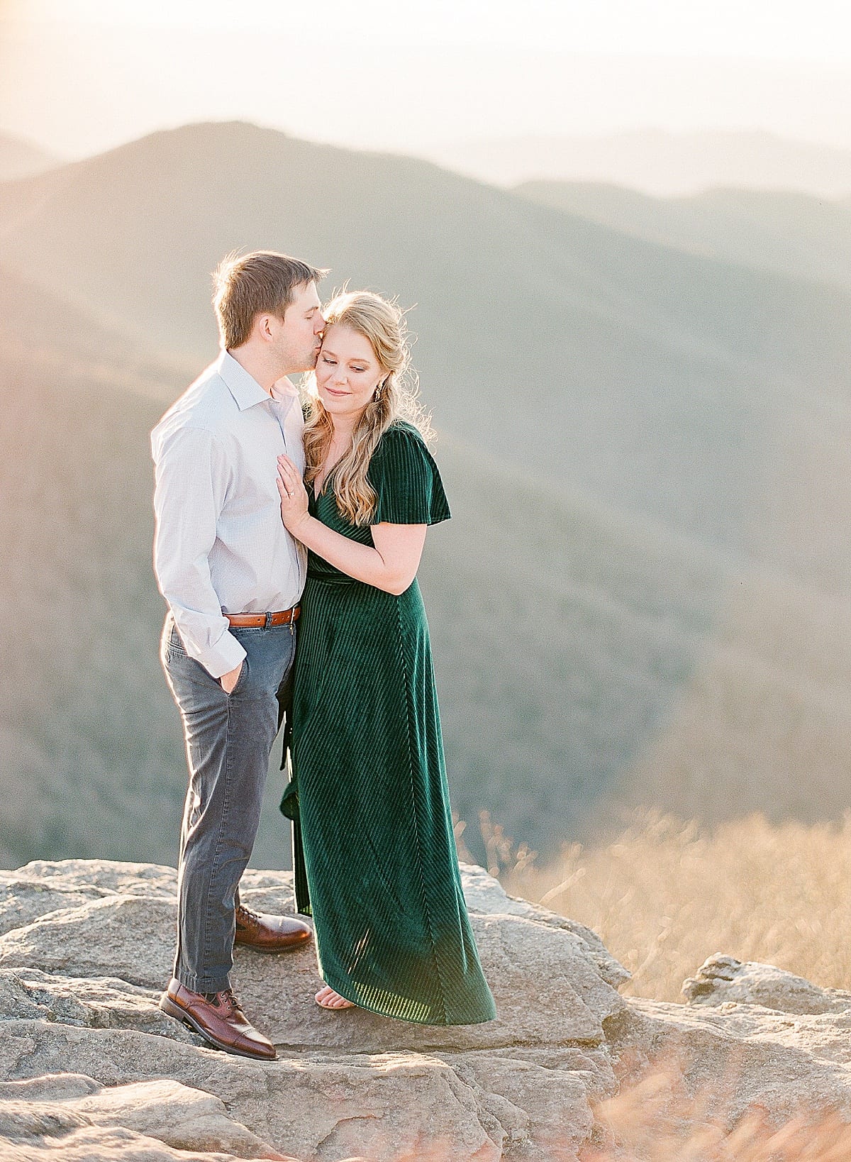 Mountaintop Engagement Session Couple Snuggling Together Photo