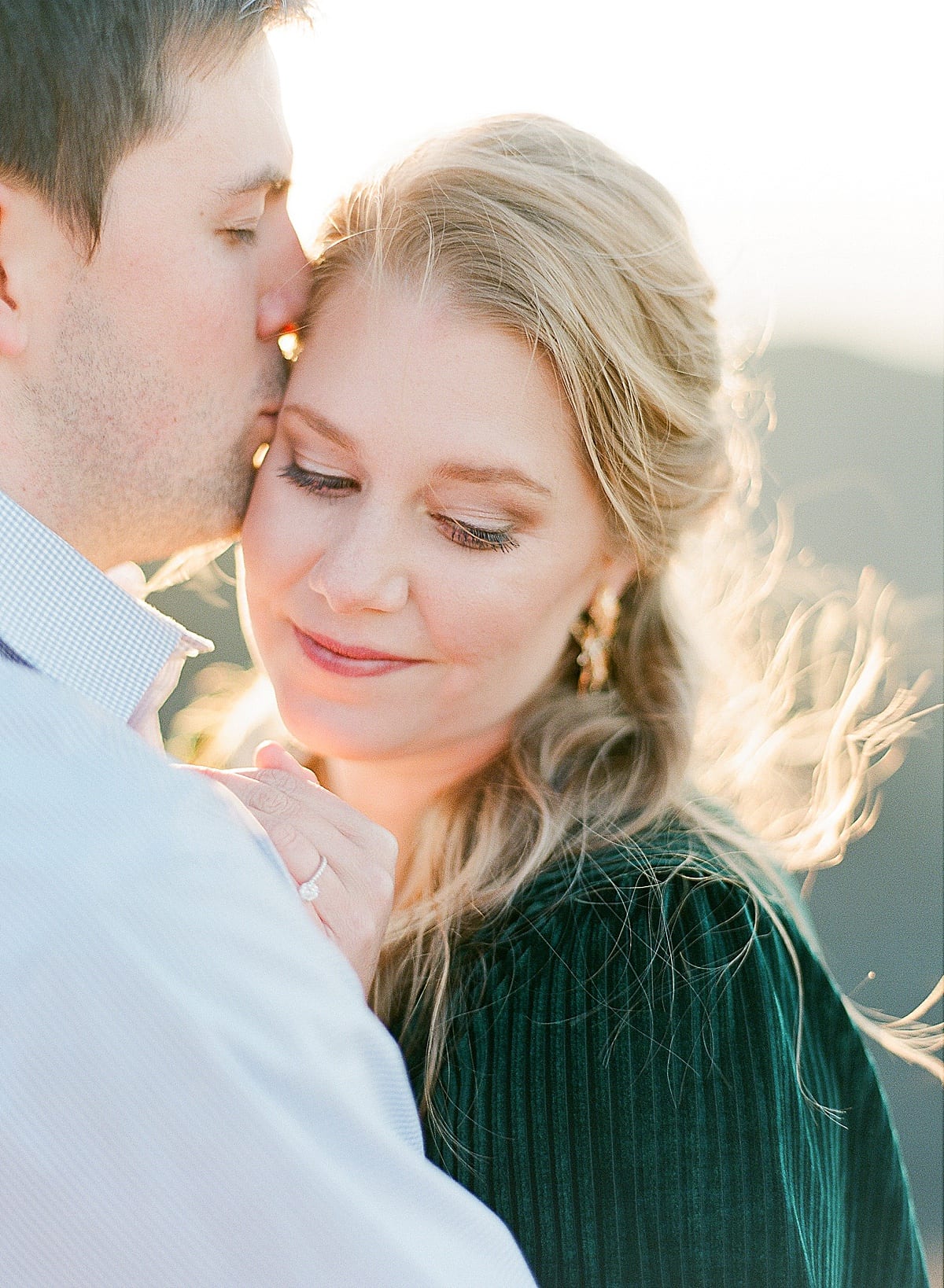 Mountaintop Engagement Session Guy Kissing Girl on Temple Photo