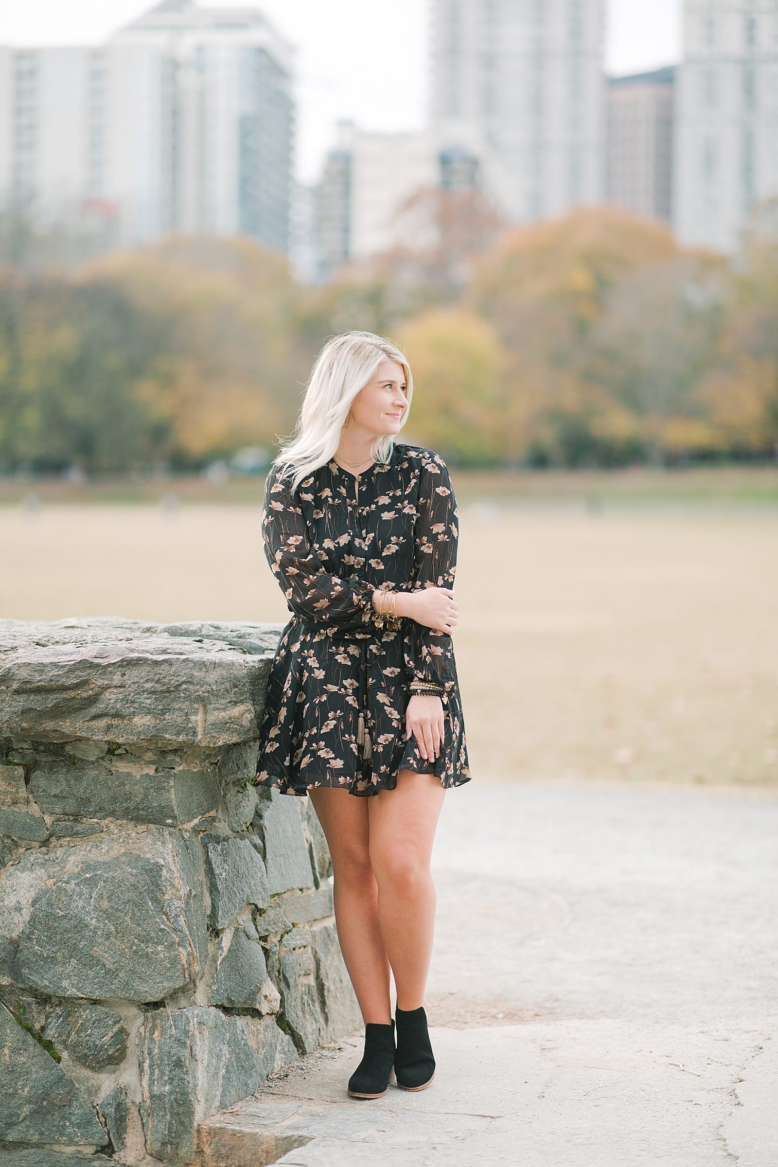 Girl Leaning on Stone Wall with City in Background in Atlanta Photo