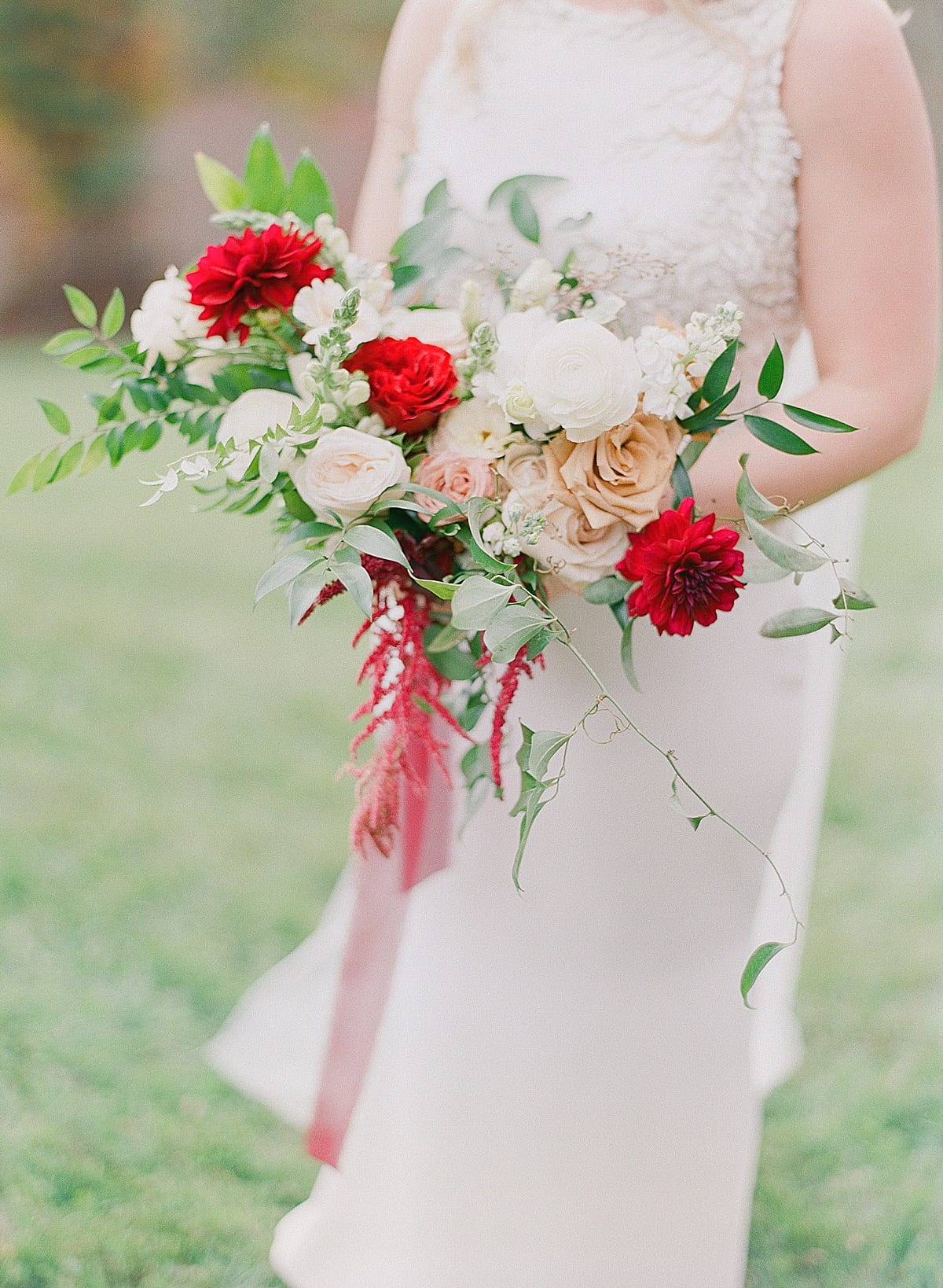 Detail of Brides Bouquet with Red White and Pink Flowers Photo