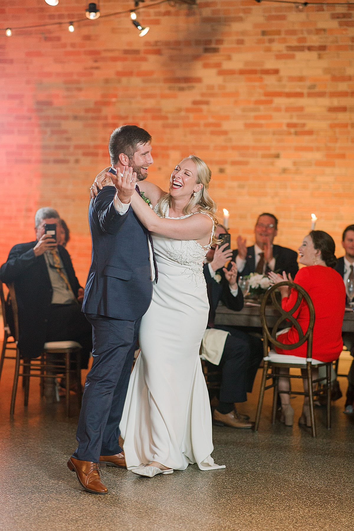 Bride and Groom Laughing During First Dance Photo