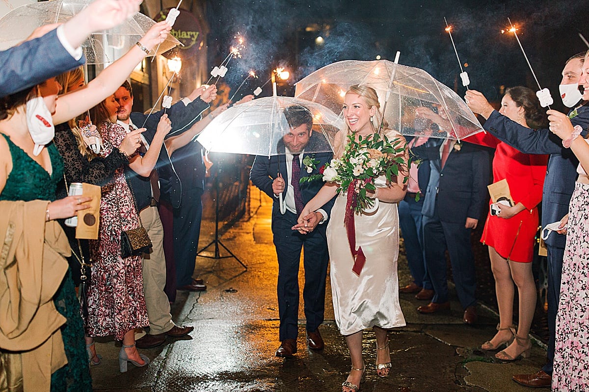 Bride and Groom Exiting Wedding in The Rain Photo