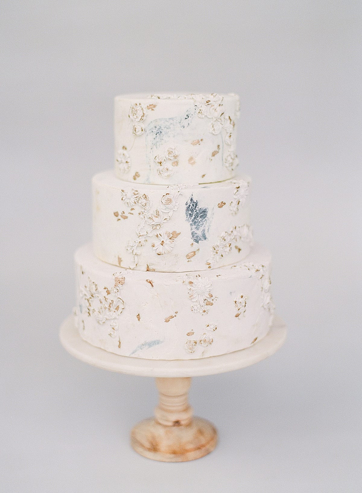 Wedding Cake Ideas Three Tier Cake with Bas Relief and Gold Leafing Photo