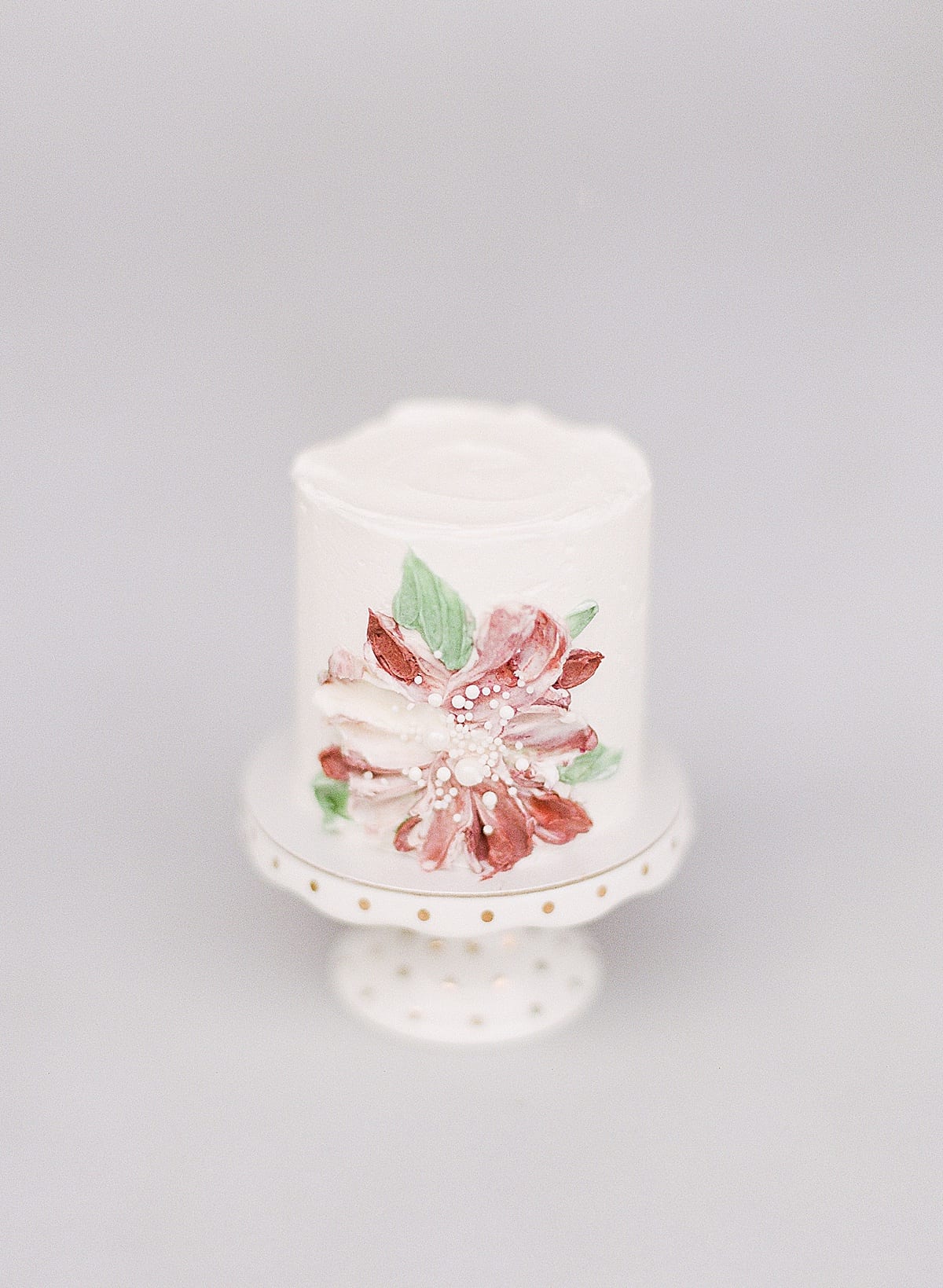 Small Cake with Red Flower Painted On Photo