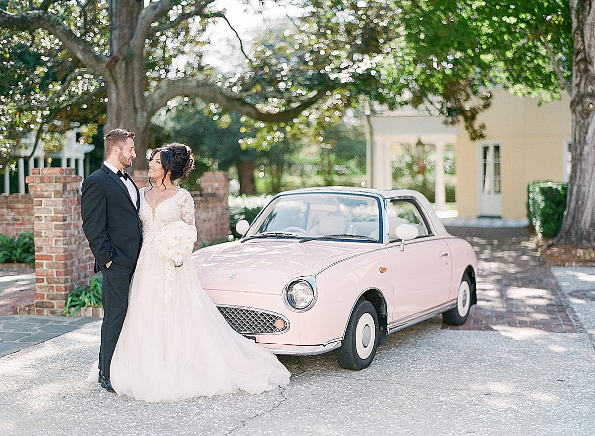 Bride and Groom in front of Pink Car at William Aiken House Photo
