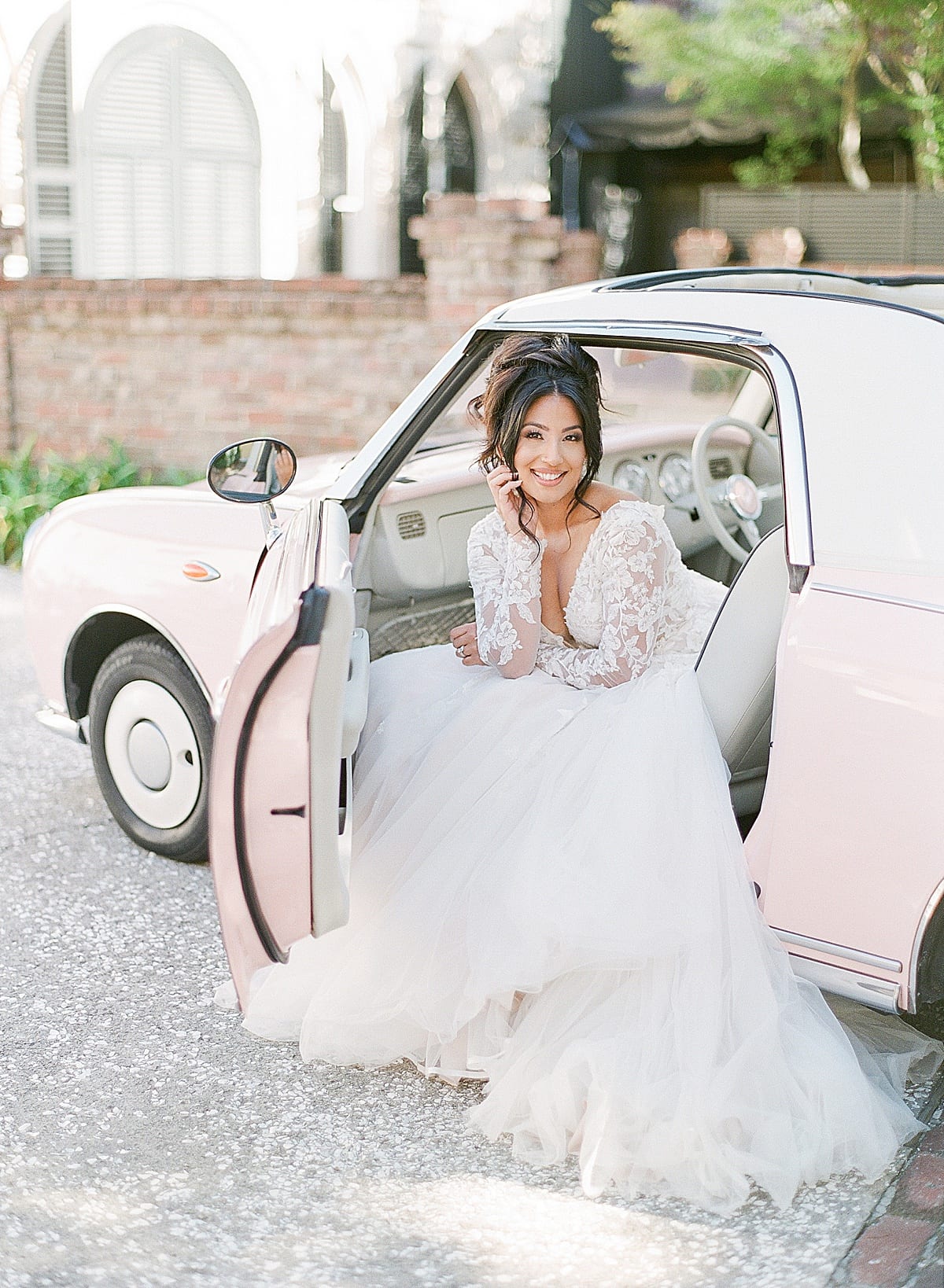 Bride Sitting in Vintage Pink Car in Charleston Photo