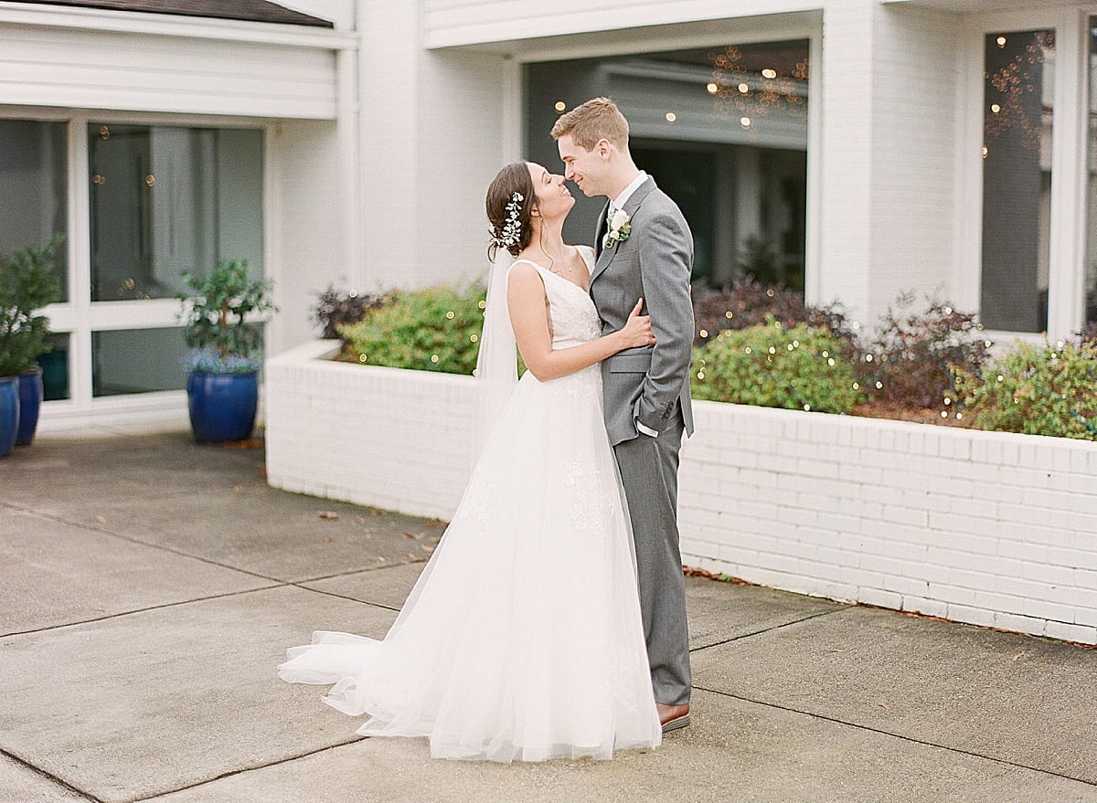 Charlotte Wedding Photographer Bride and Groom Hugging and Smiling Photo
