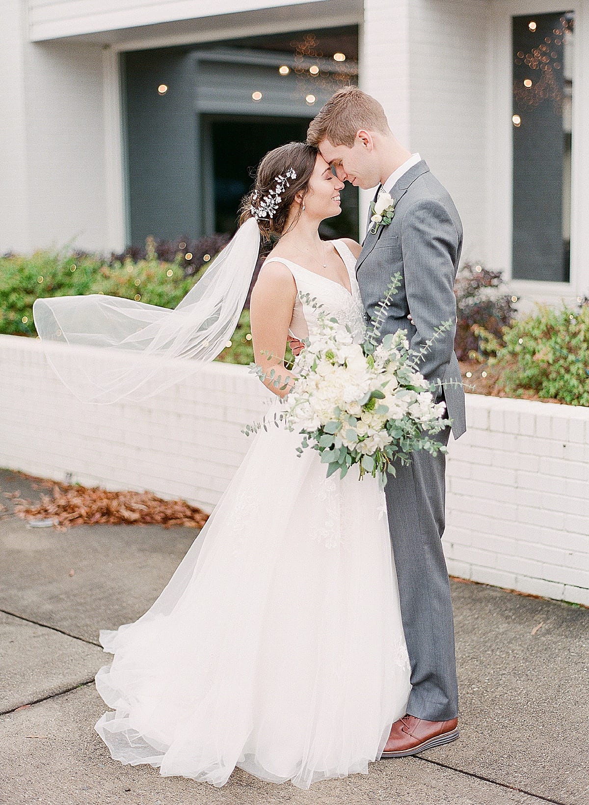 Charlotte Wedding Photographer Bride and Groom Nose to Nose Veil Blowing in The Wind Photo