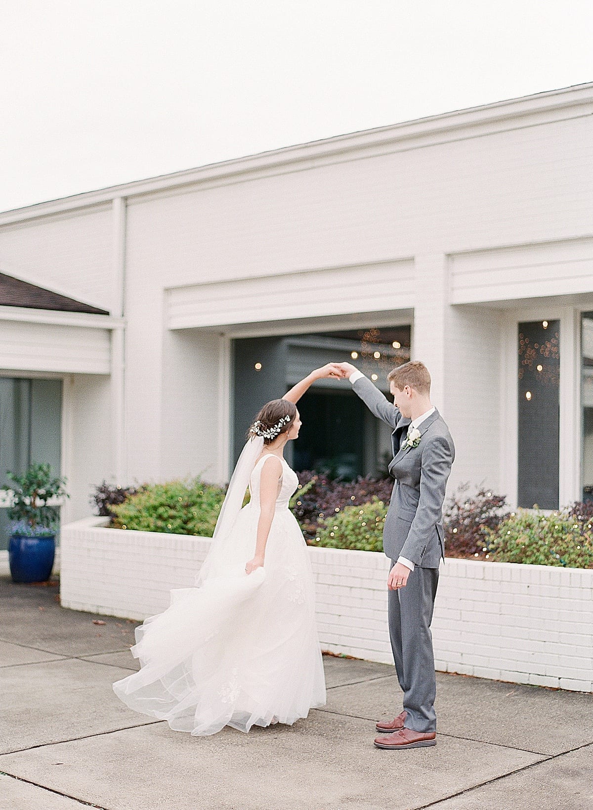 Groom Twirling Bride Photo