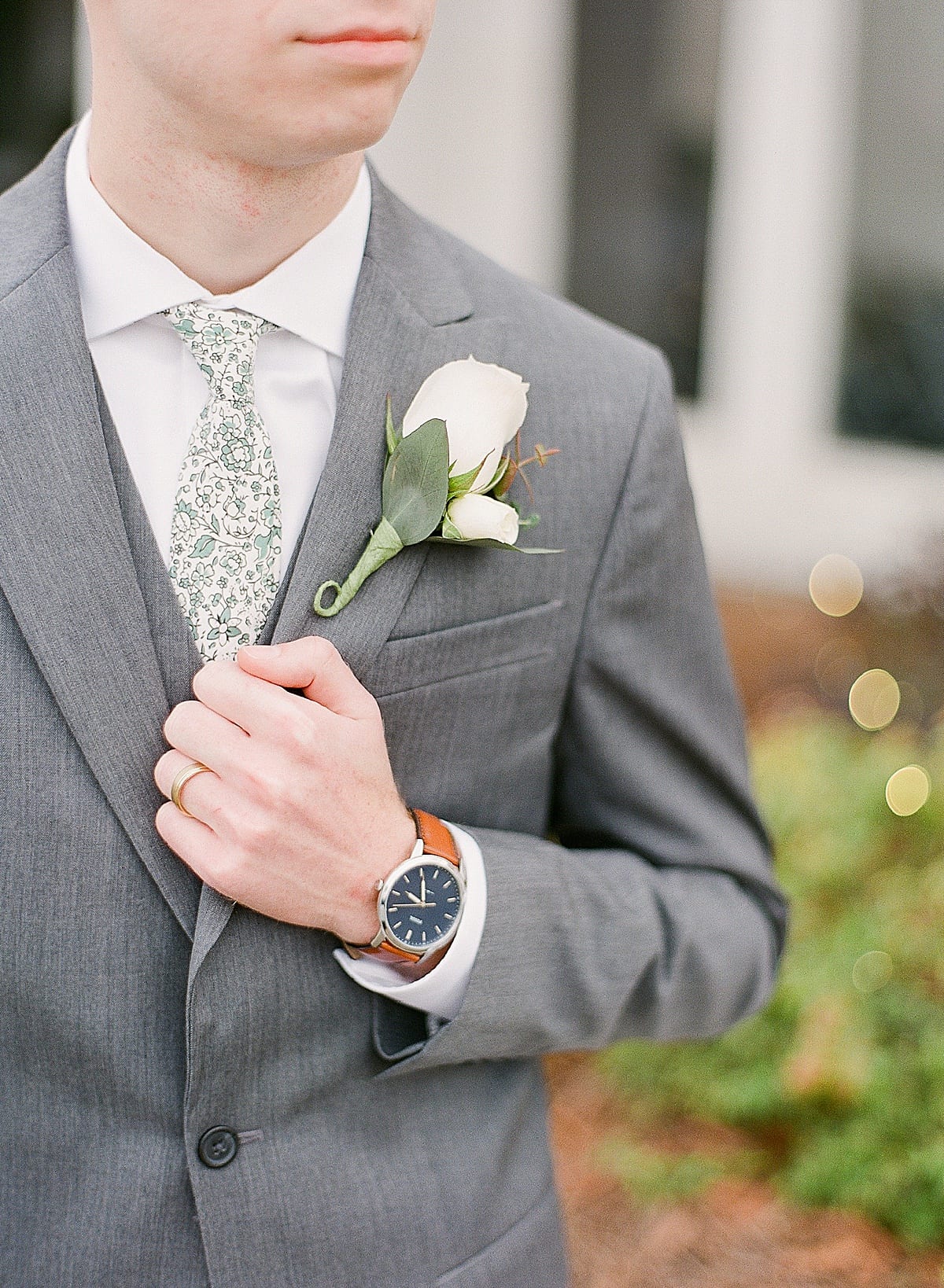 Groom Details Watch, Boutonniere, and Tie Photo