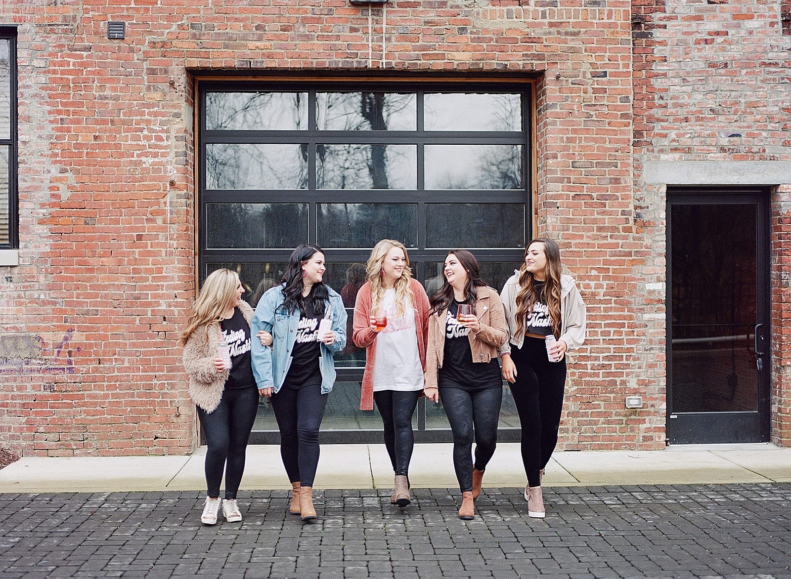 Bachelorette Weekend Itinerary Girls walking toward camera laughing photo