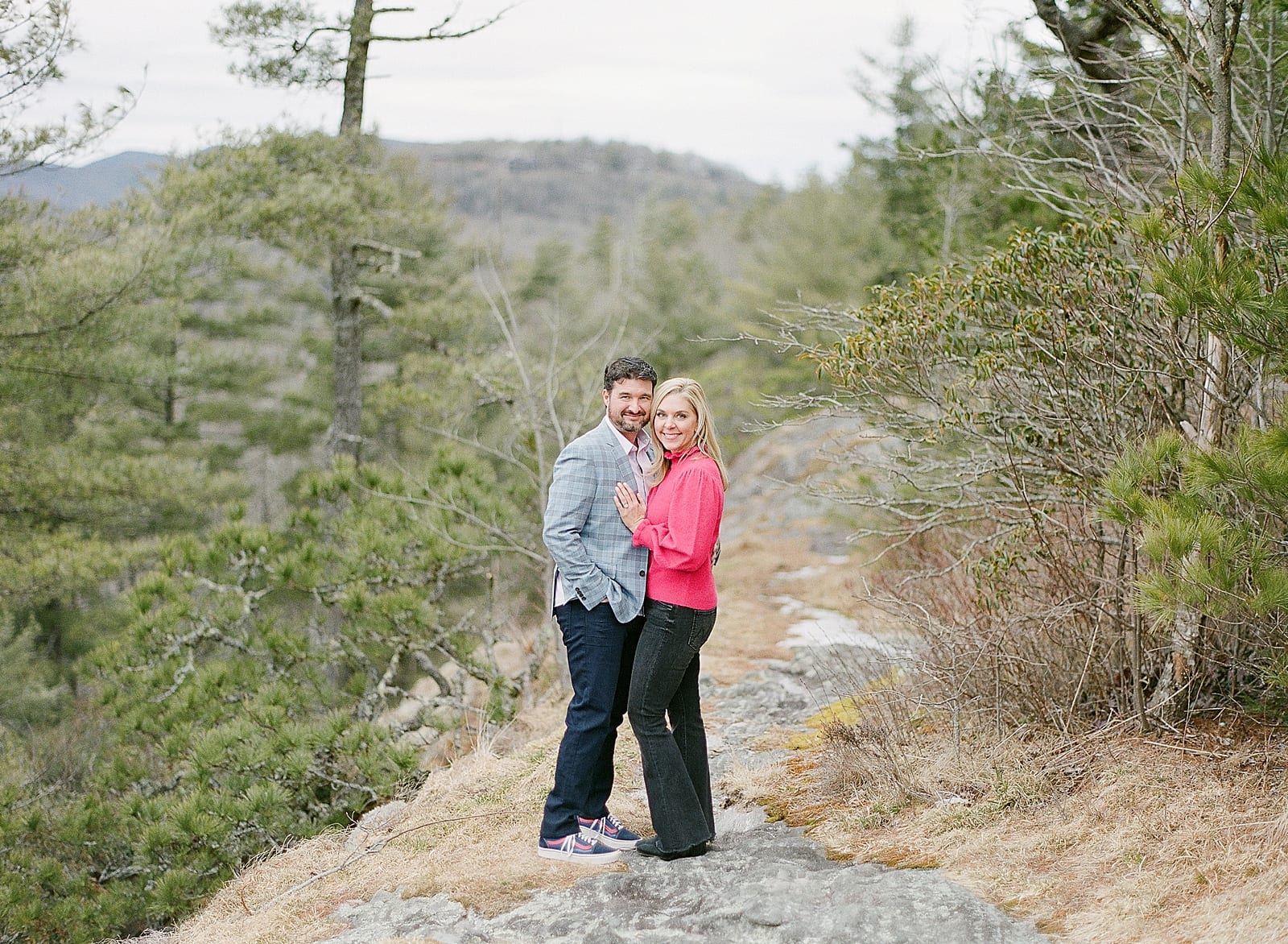 Couple smiling at camera at Sunset Rock in Highlands NC 
