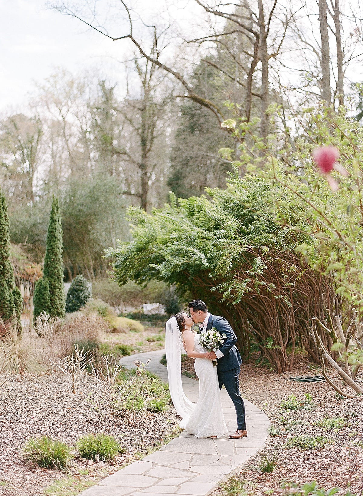 Cator Woolford Gardens Bride and Groom Kissing In Garden Photo