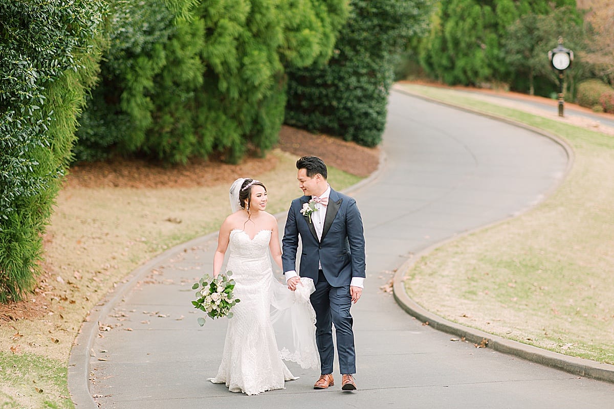 Country Club Of The South Bride and Groom Holding Hands Walking Photo