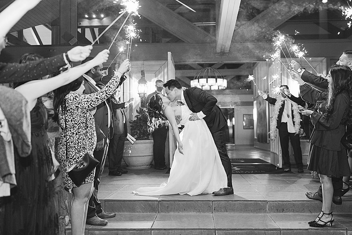 Country Club Of The South Black and White of Bride and Groom Sparkler Exit Photo