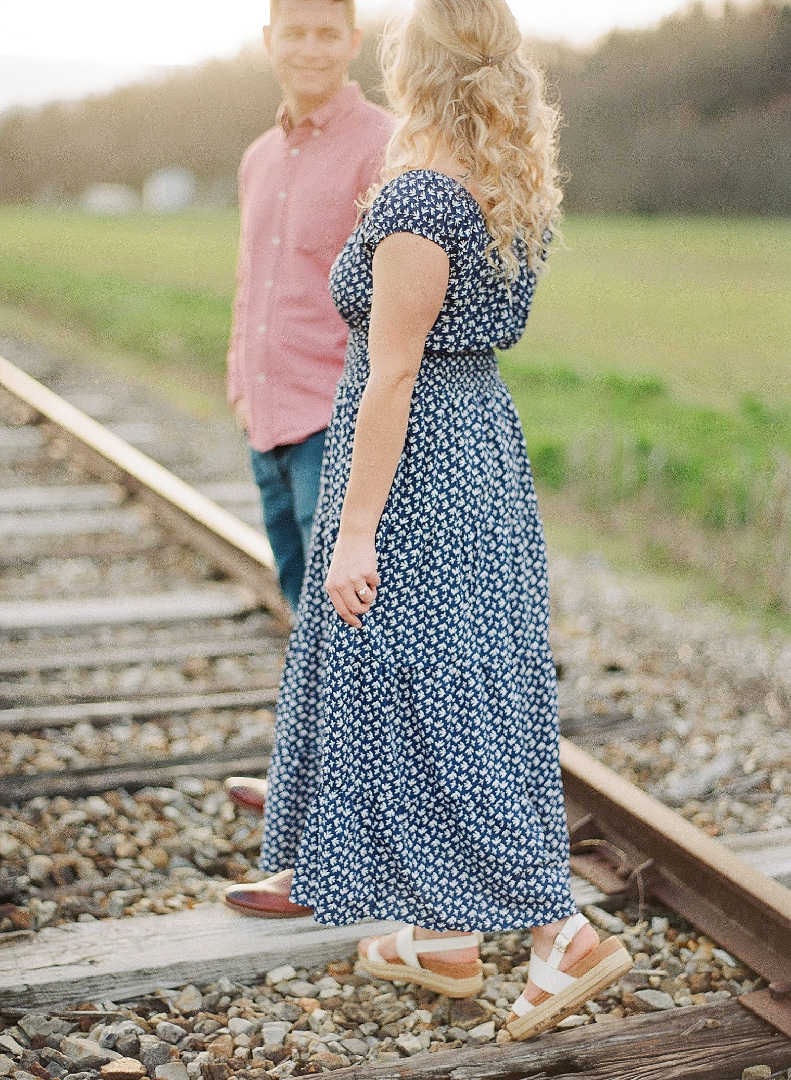 Couple smiling at each other walking photo