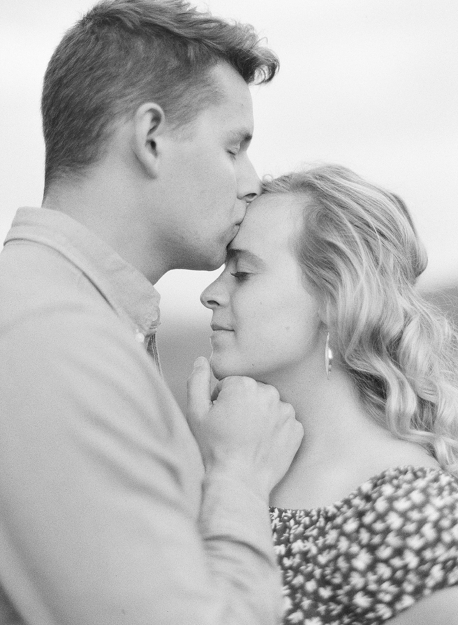 Black and White of Couple kissing photo