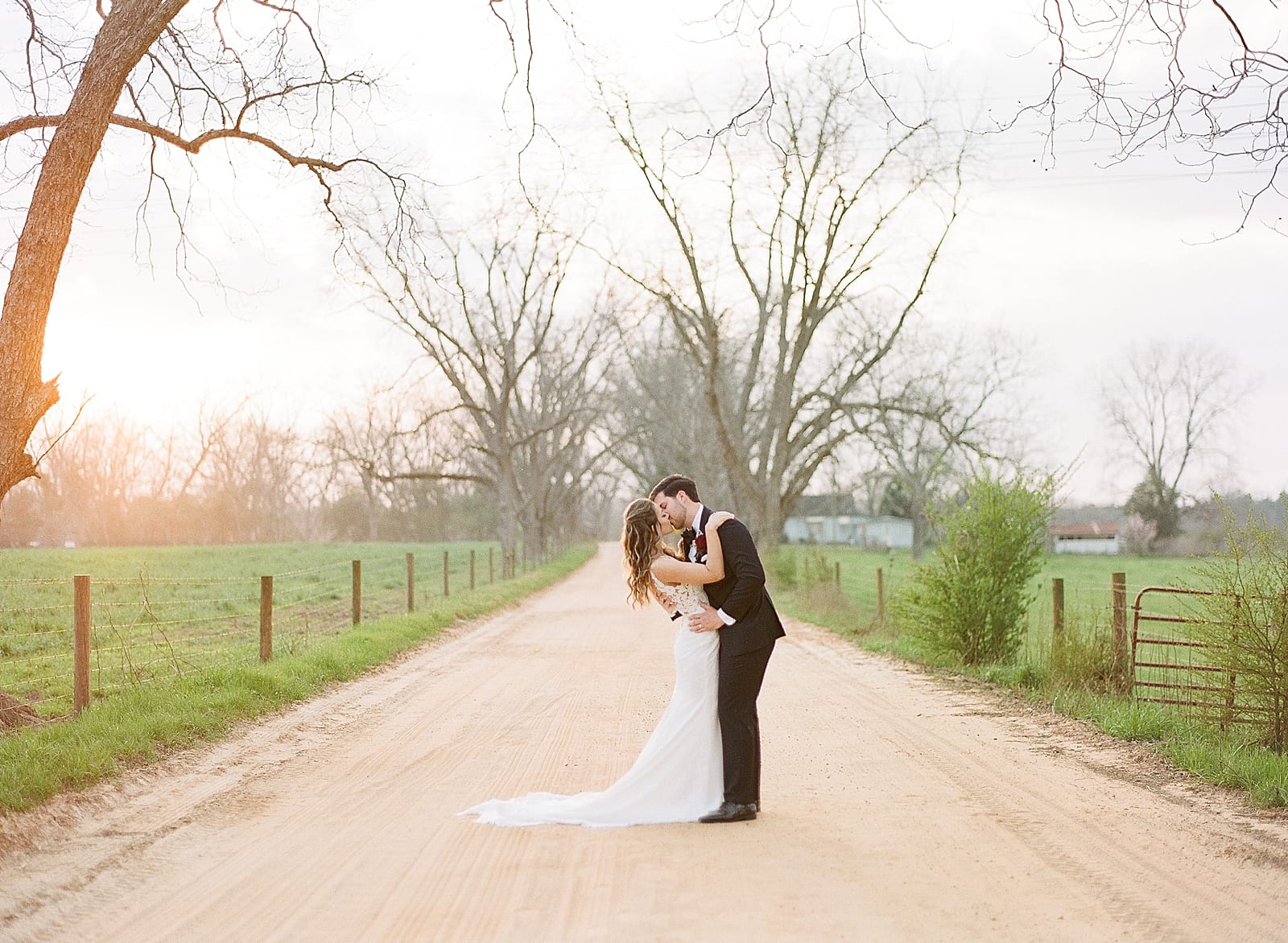 Savannah GA Wedding Photographer Bride and Groom Kissing on Dirt Road Photo