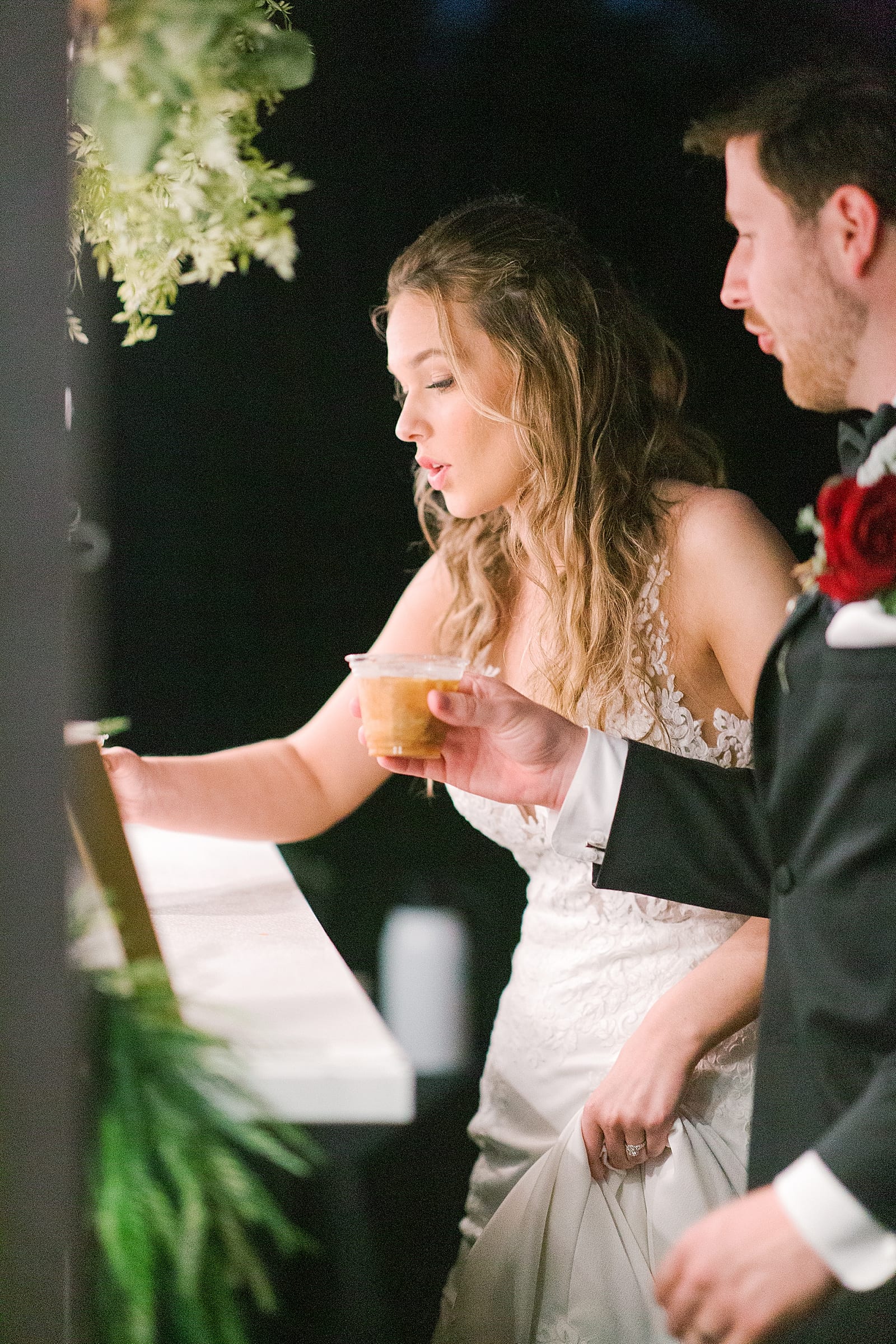 Bride and Groom Getting Coffee During Wedding Reception Photo