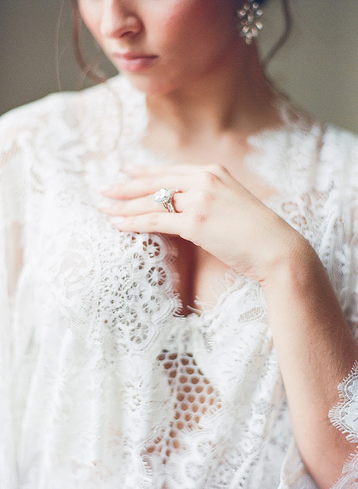 Boudoir Ideas Detail of Brides Bust in Lace Robe Photo