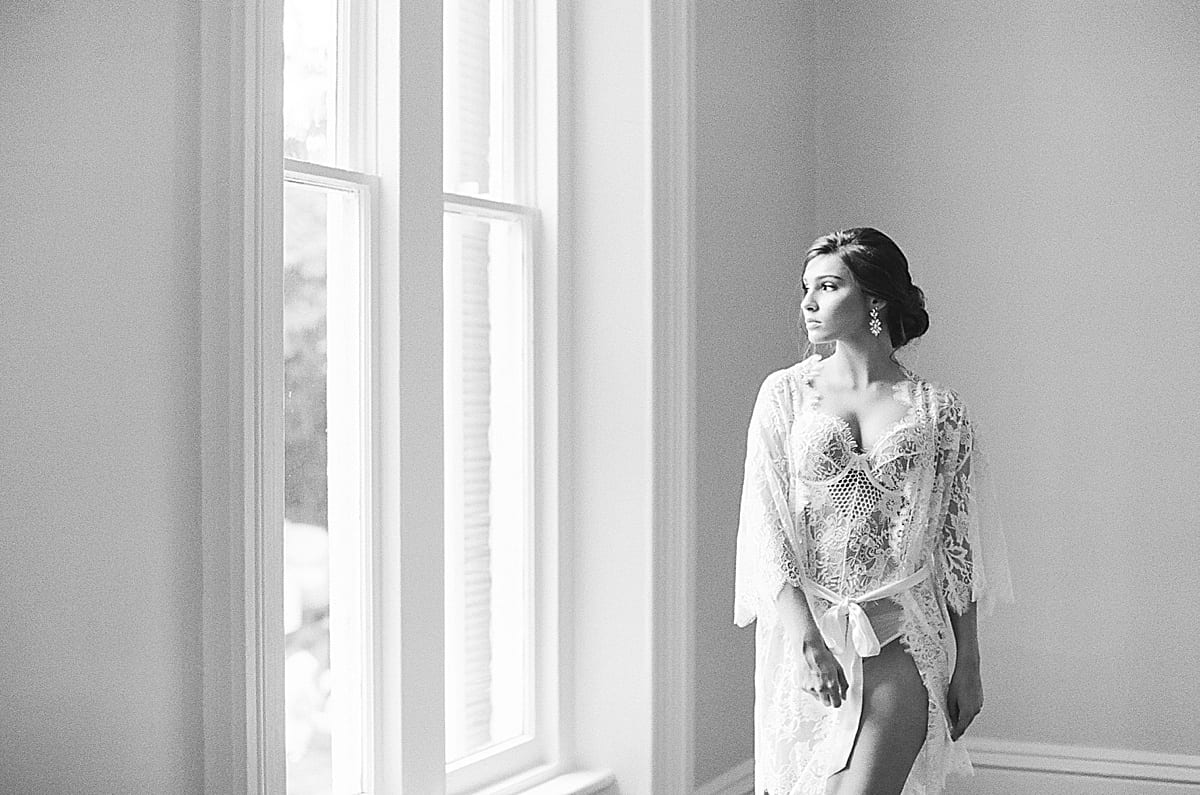 Boudoir Ideas Black and White of Bride in Lace Robe Looking Out Window Photo