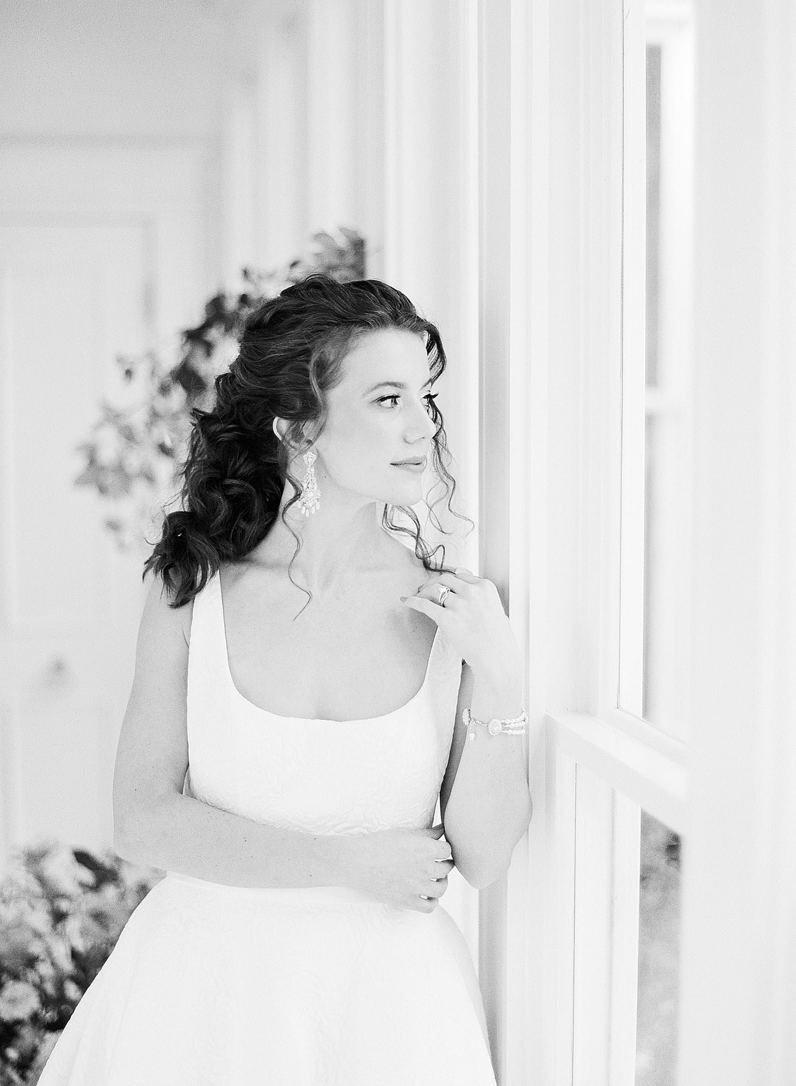 Bridal Portraits Black and White of Bride Looking Out the Window Photo
