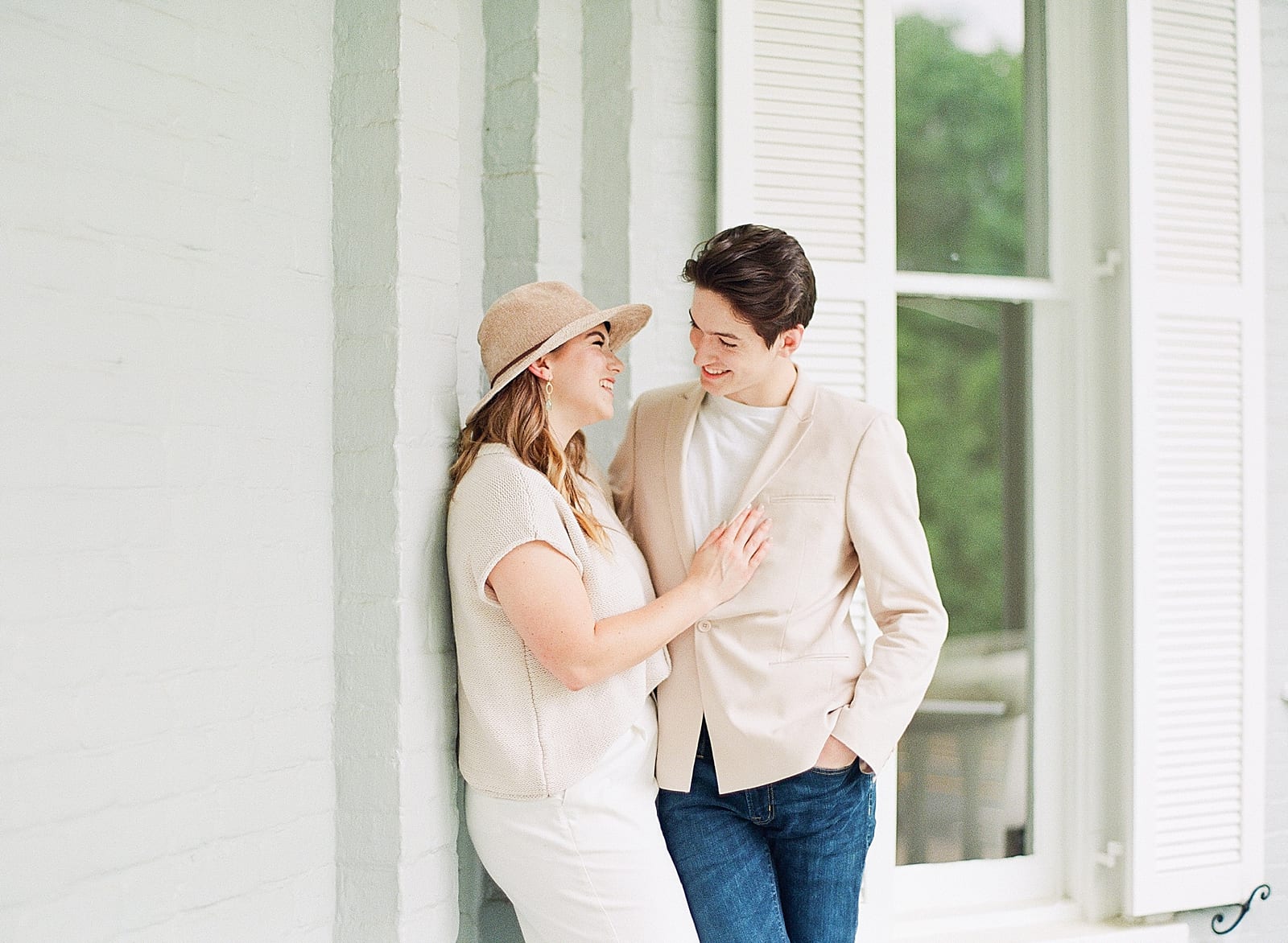 Greensboro NC Engagement Couple Laughing on Porch Photo