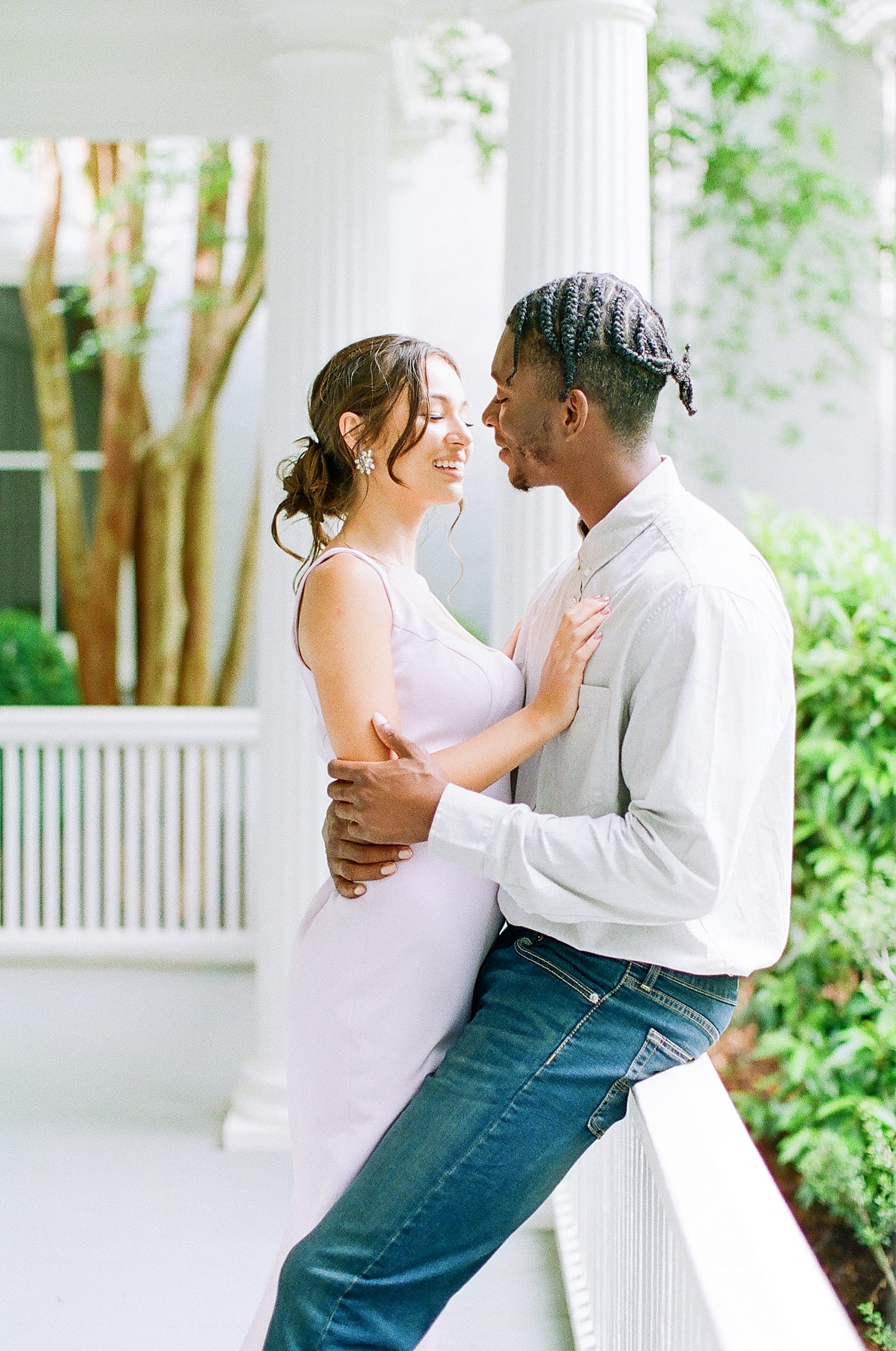McAlister Leftwich House Engagement Couple Snuggling On Porch Photo