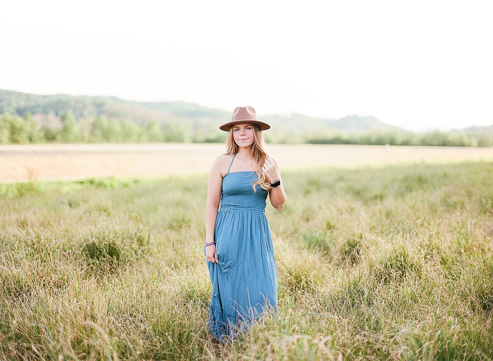 Asheville Senior Photos girl in field with blue dress photo