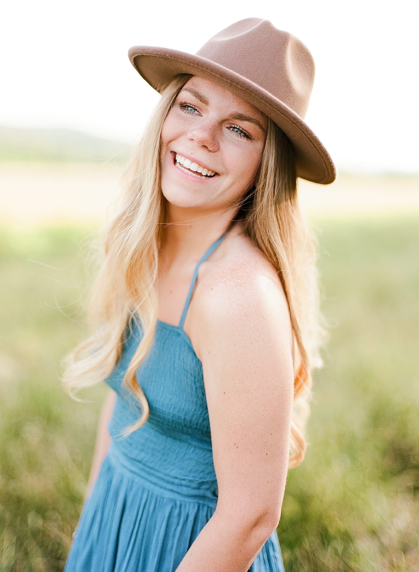 Asheville Senior Photos girl smiling in blue dress and hat photo