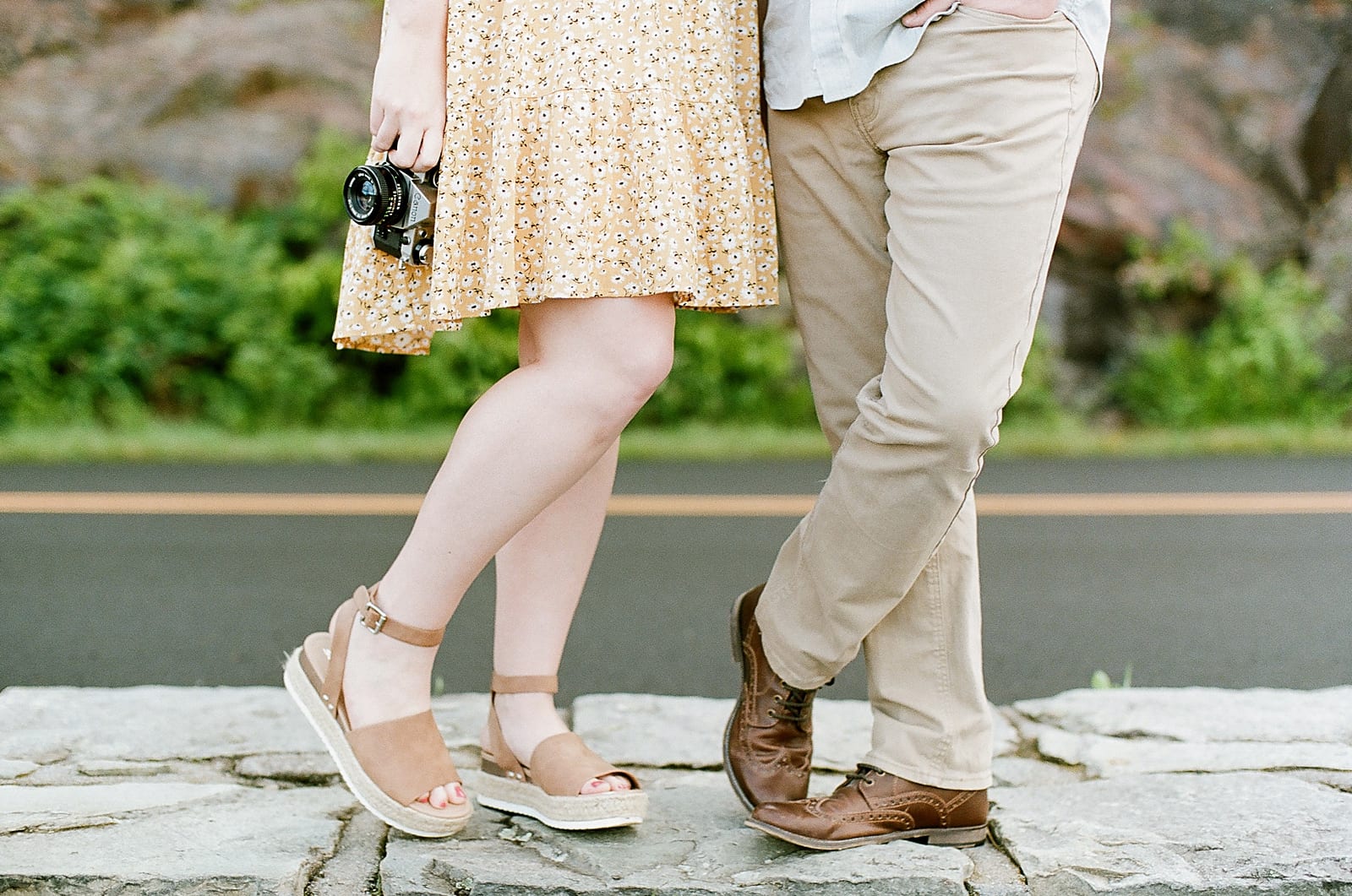 Couples Feet Girl Holding Camera Guy Hand in Pocket Photo