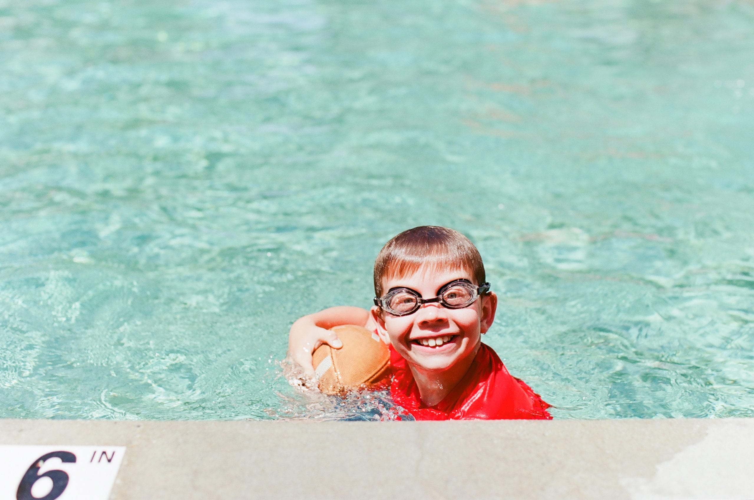 Kodak Ektar 100 Kid in Pool with goggles photo
