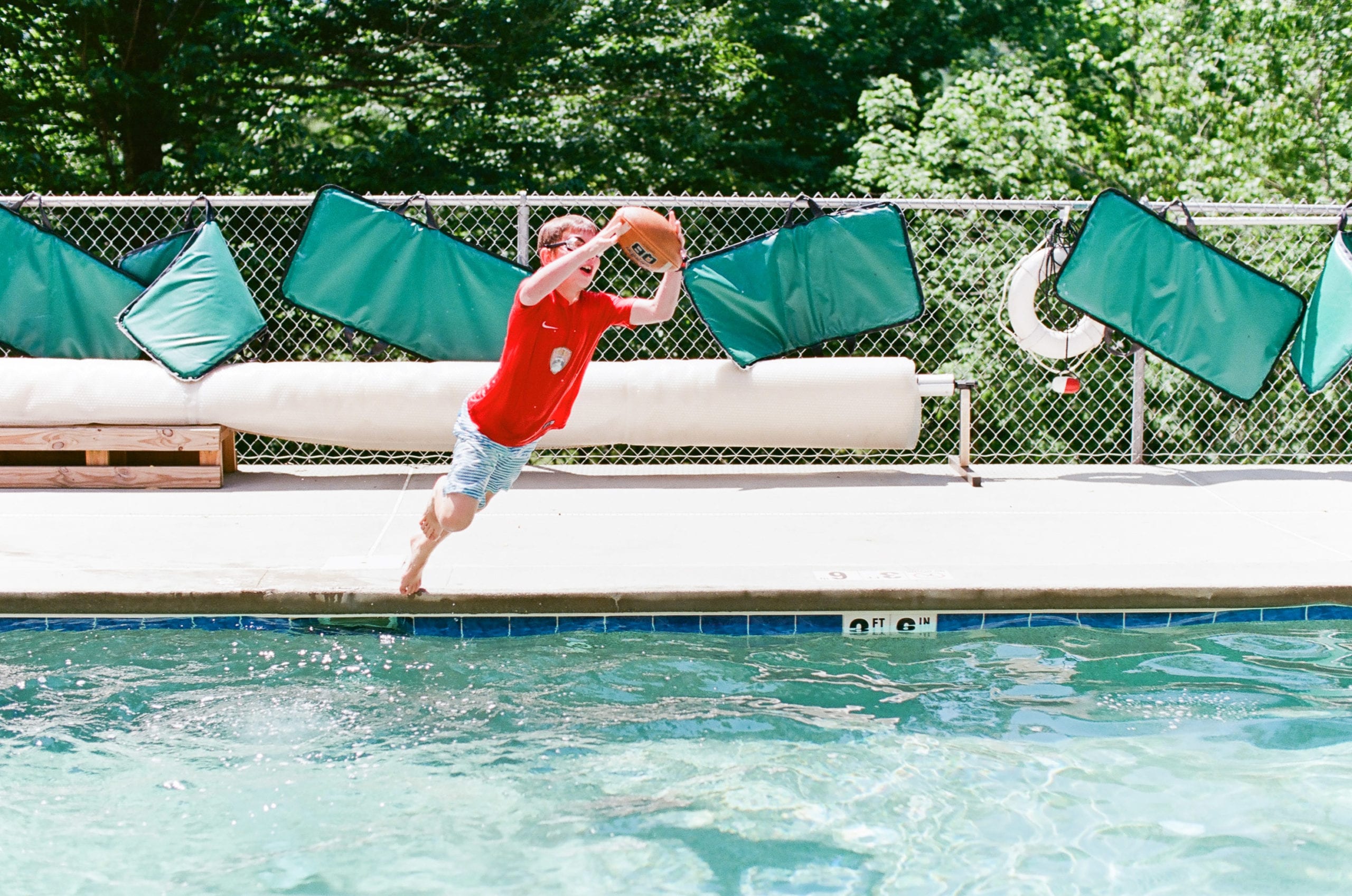 Kodak Ektar 100 Kid jumping in pool for football photo