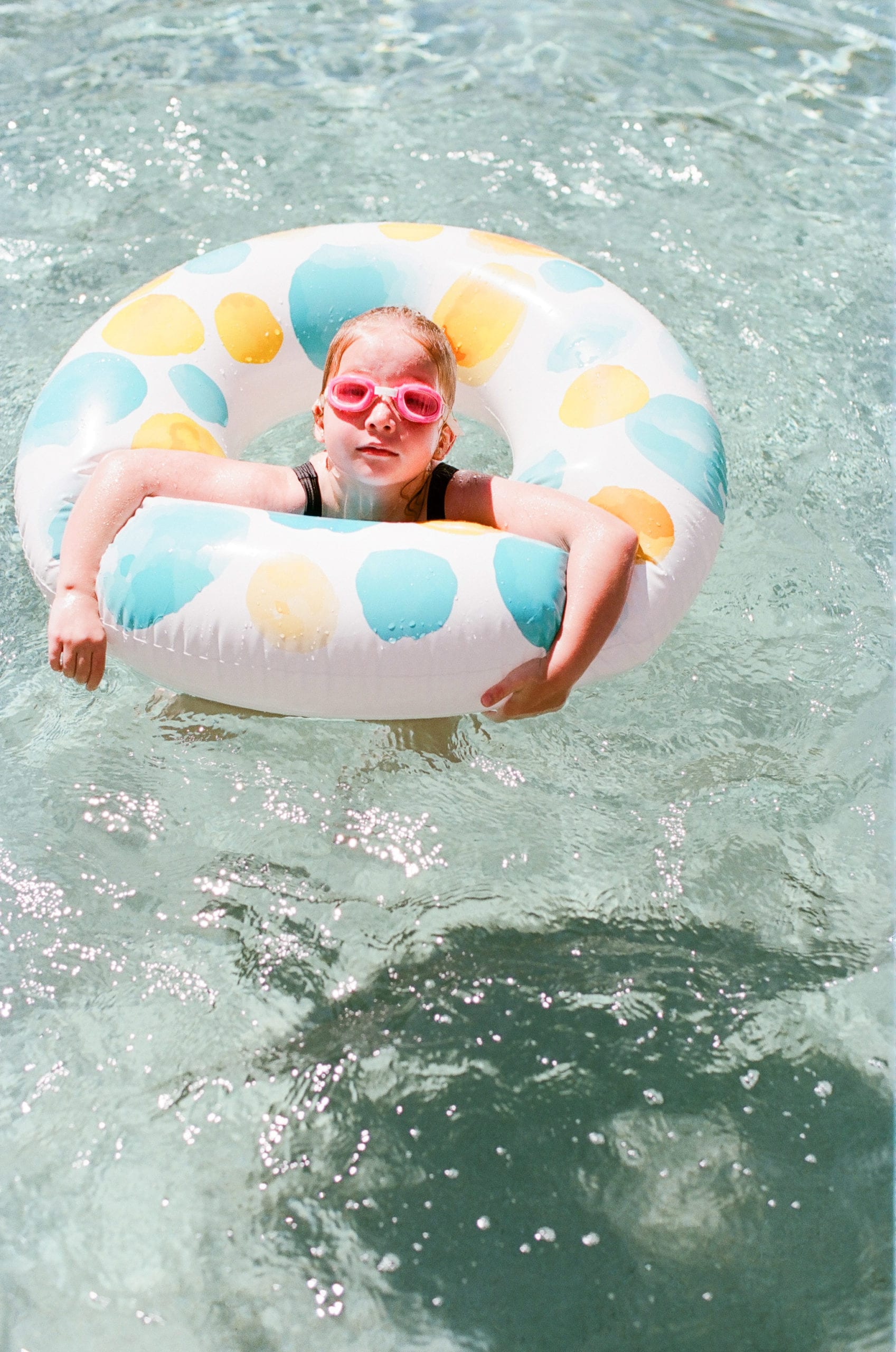 Kodak Portra 160 film girl in pool ring with googles photo