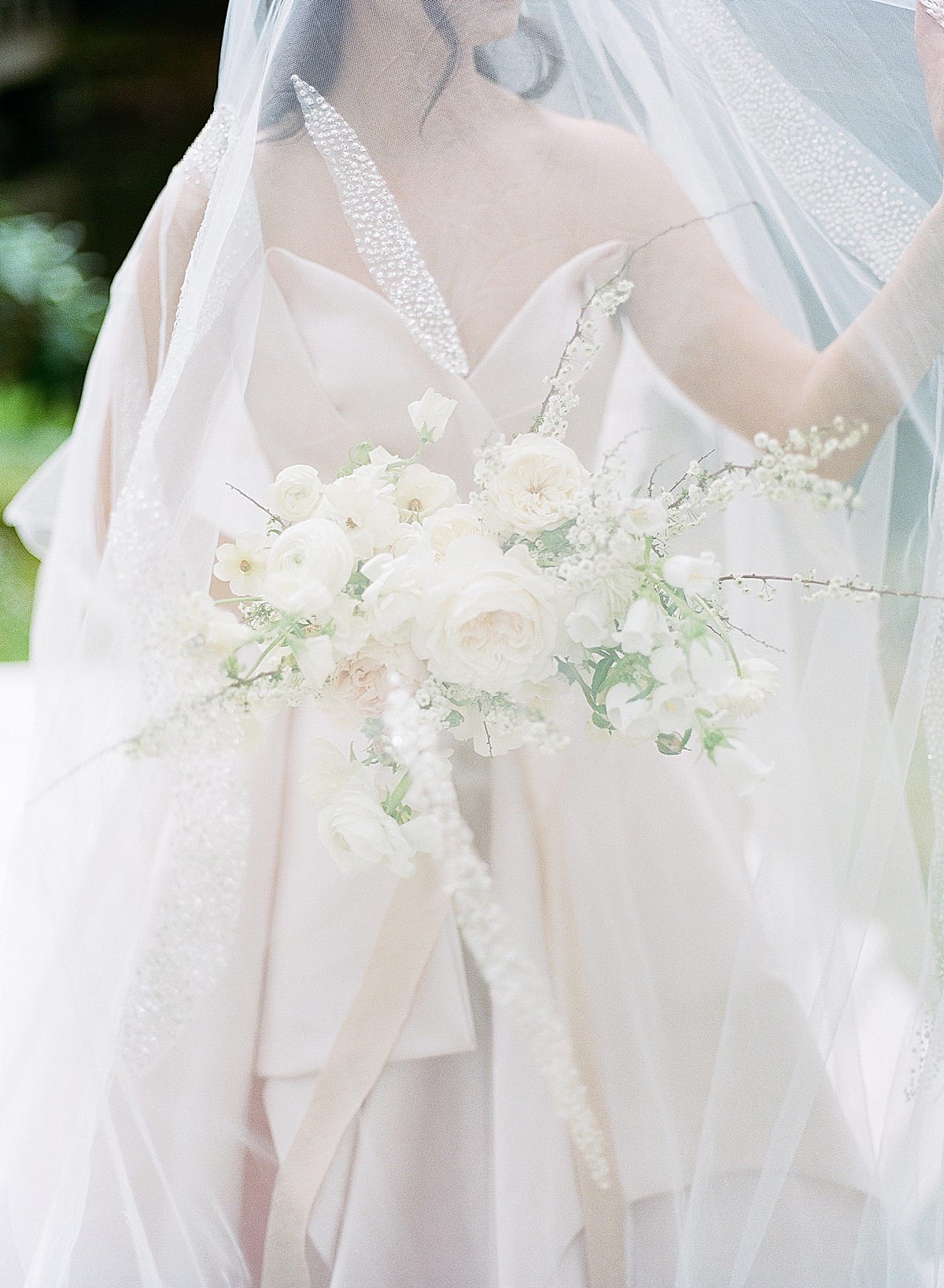 Bridal Bouquet Under Veil Photo