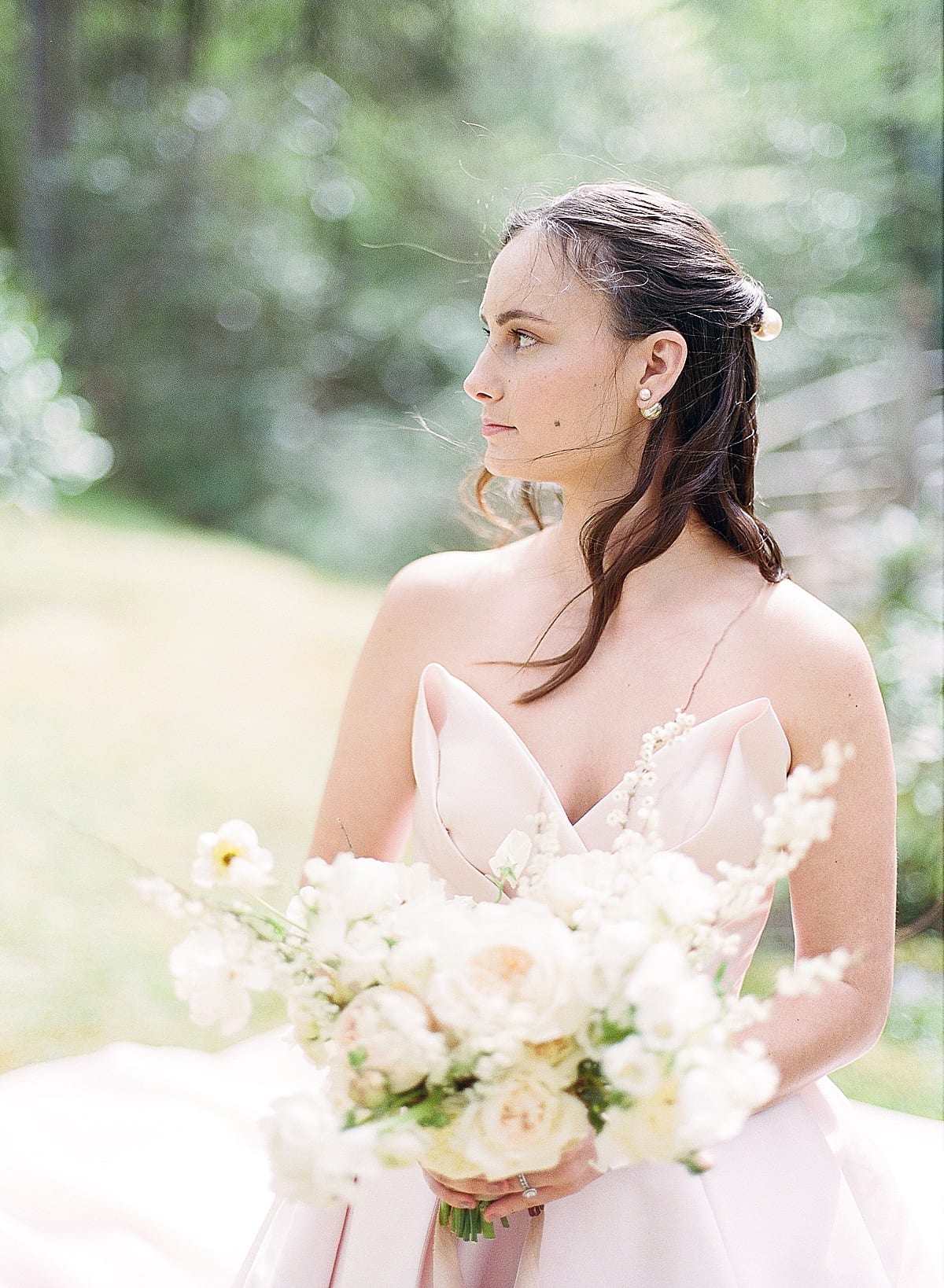 Bride Looking off holding bouquet Photo