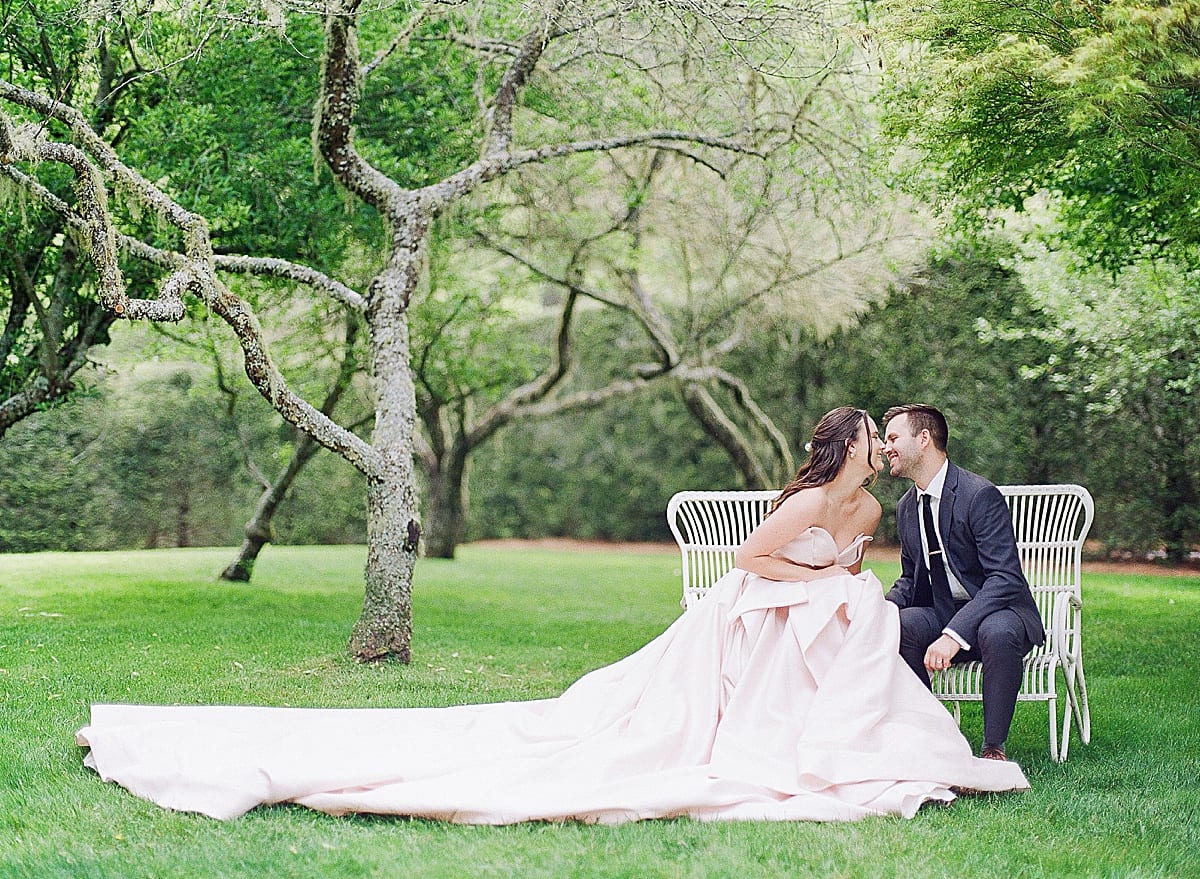 Bride and Groom in Chairs Nose to Nose Photo